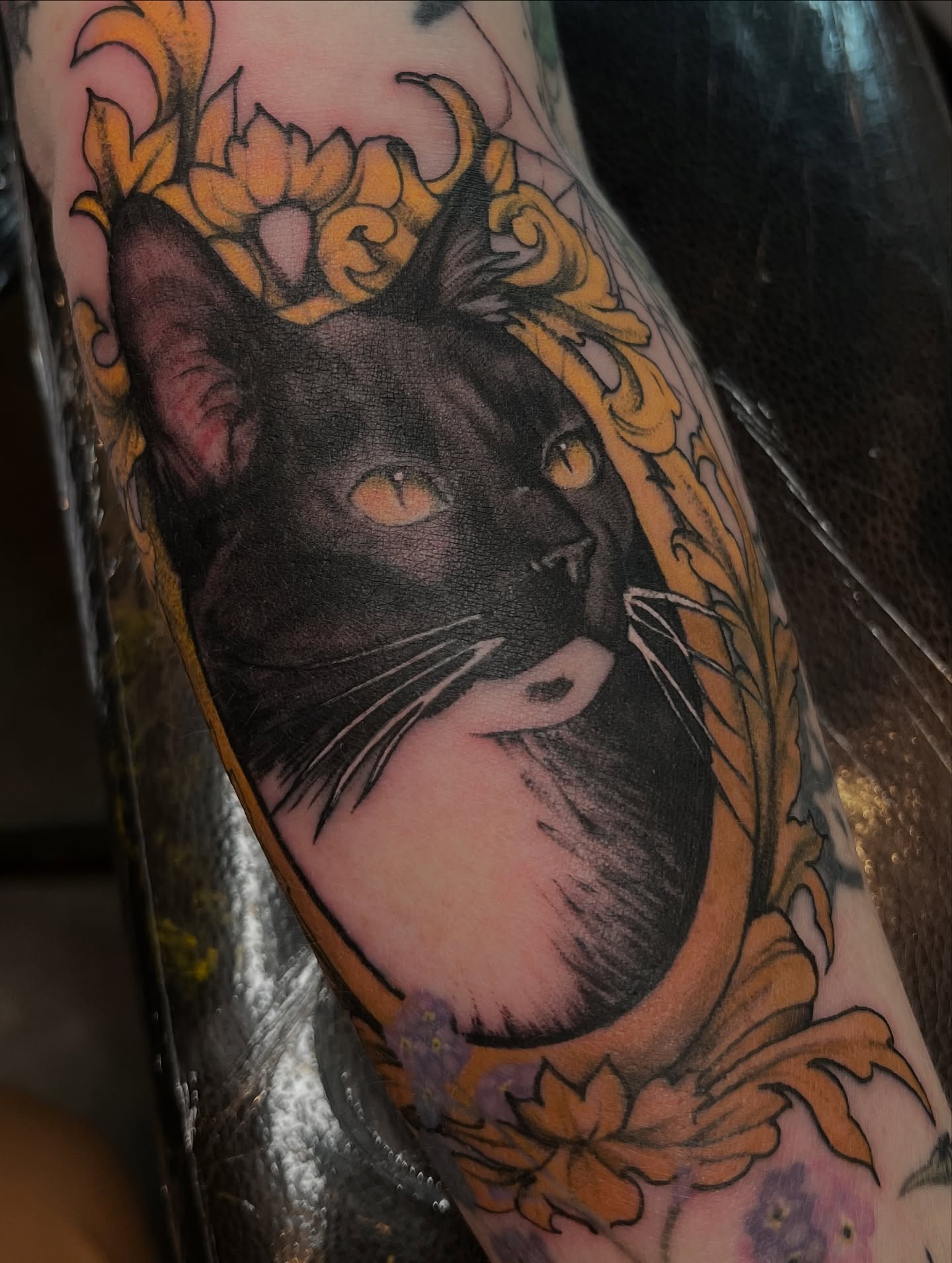 Black cat realism tattoo on the forearm by Amanda Leitch