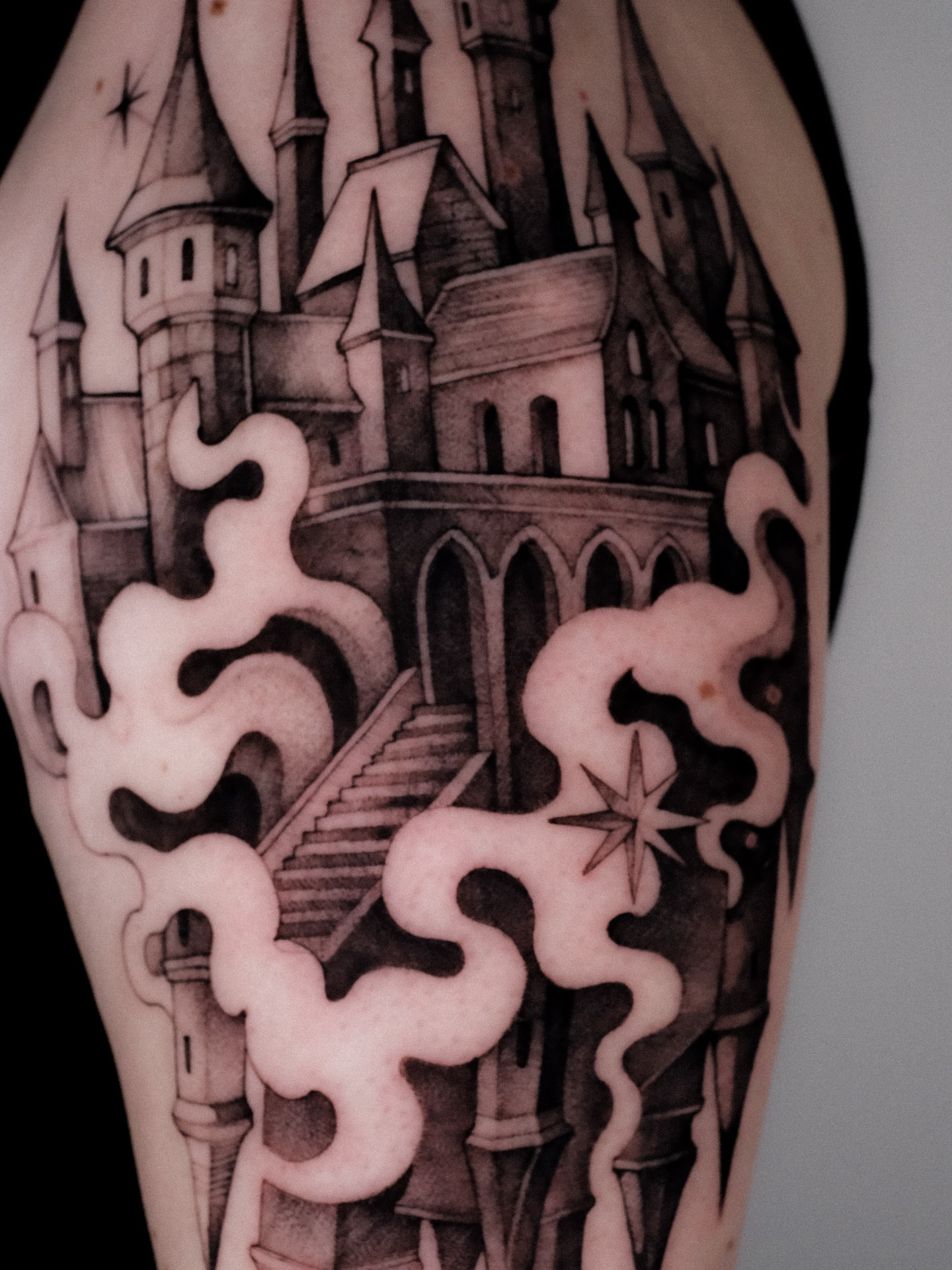 Castle black and grey tattoo on the forearm by Alena Zozulenko