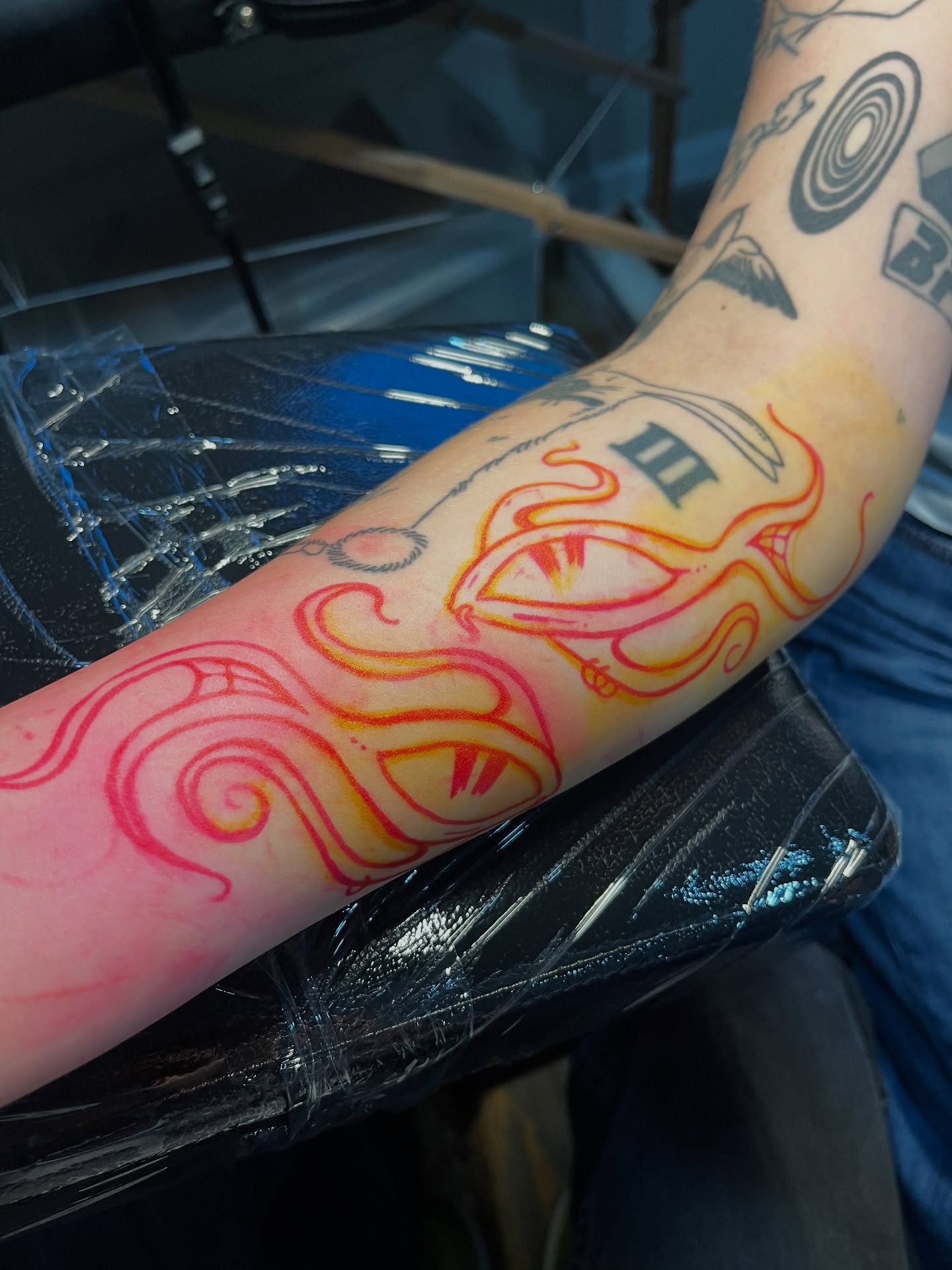 Eye with flame neo-traditional tattoo on the forearm by layne