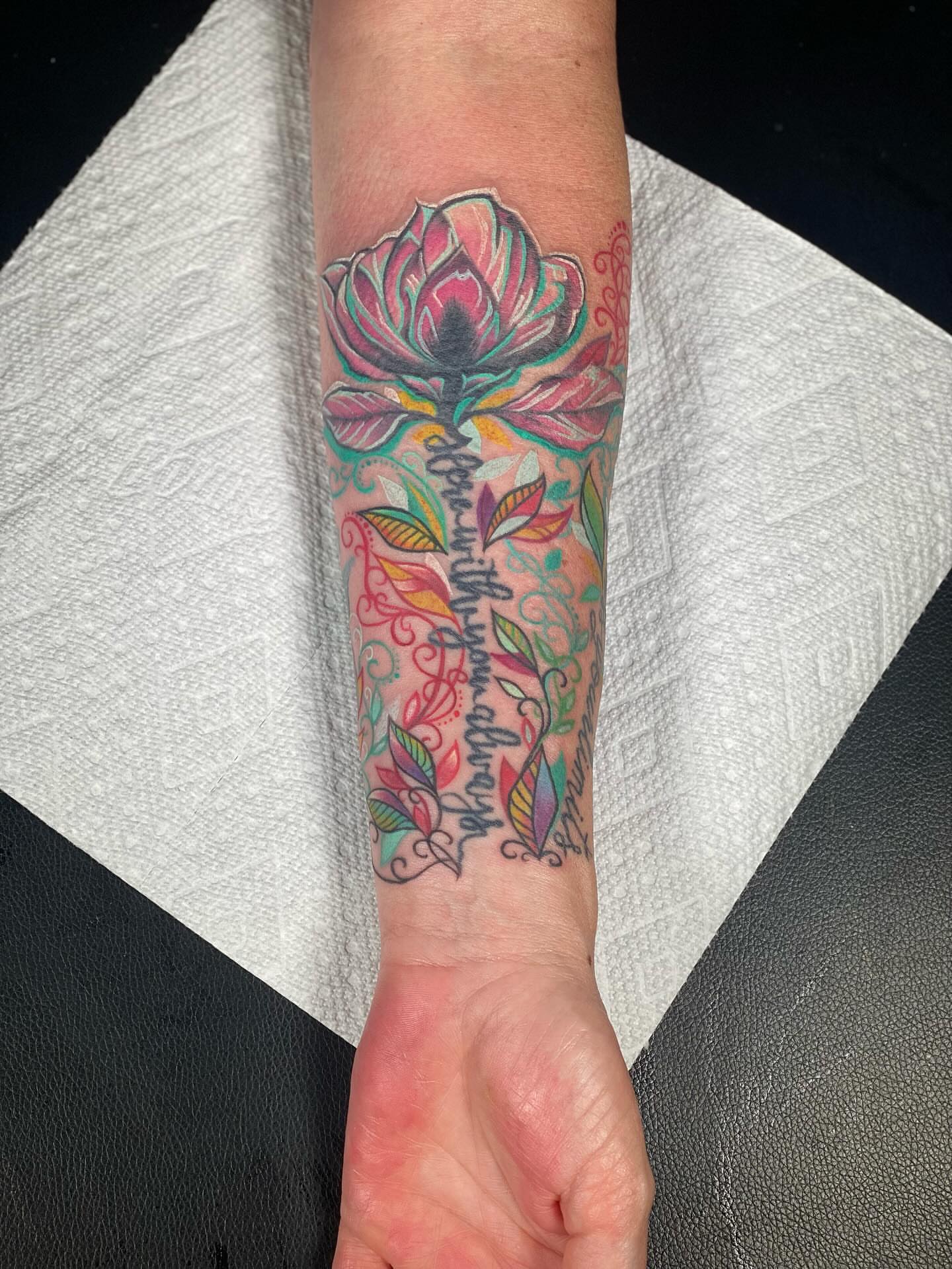 Lotus flower new school tattoo on the forearm by Chris Klee
