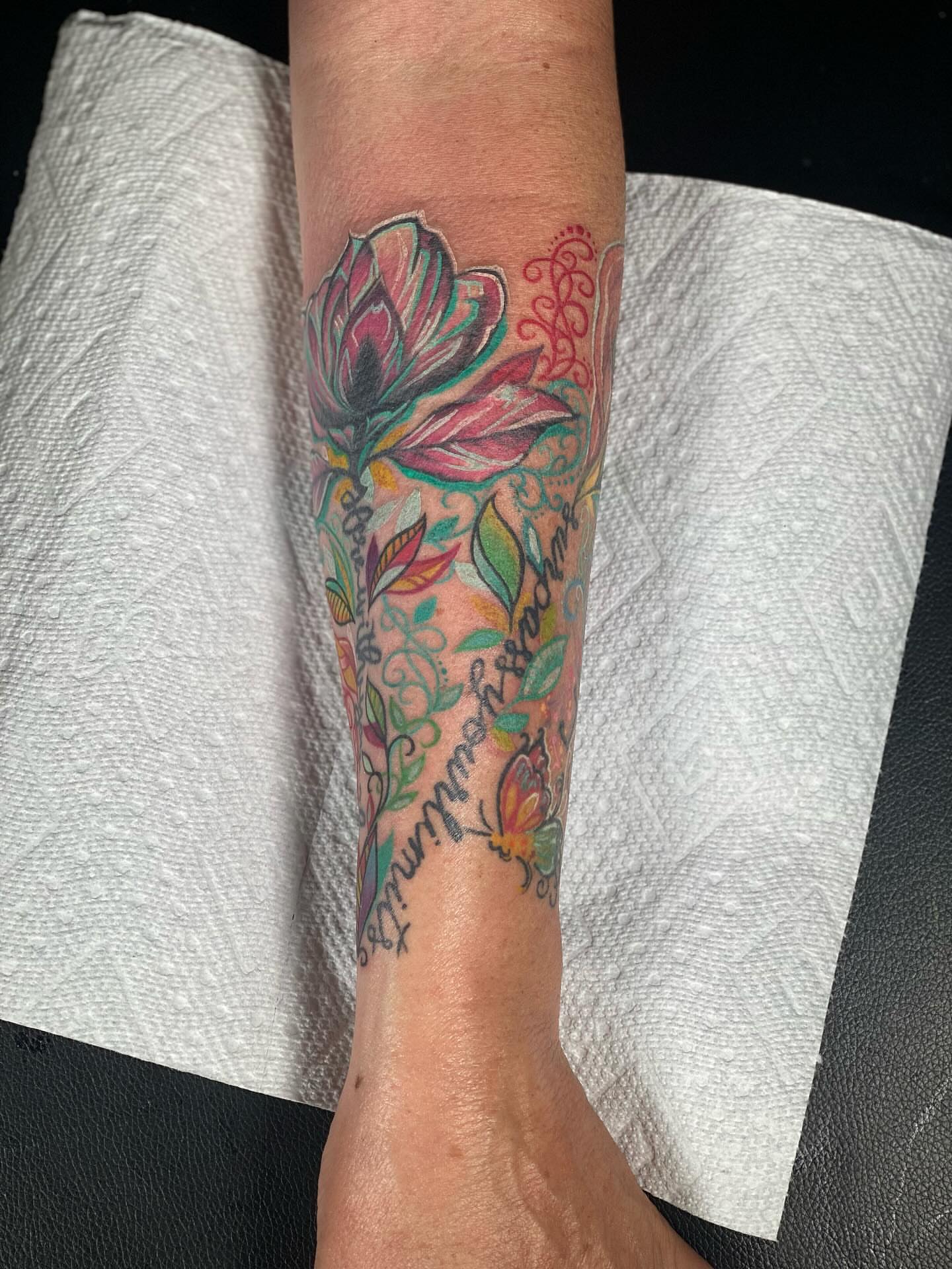 Floral design new school tattoo on the forearm by Chris Klee
