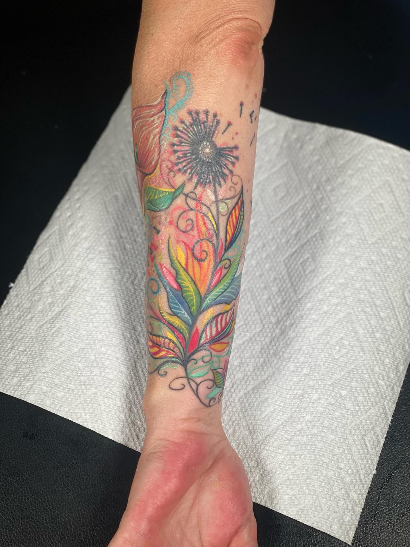 Floral arrangement new school tattoo on the forearm by Chris Klee
