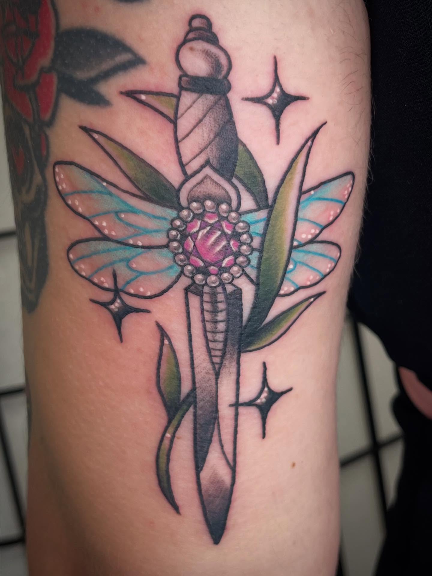 Dragonfly American traditional tattoo on the forearm by Kat (Scout) Bogart