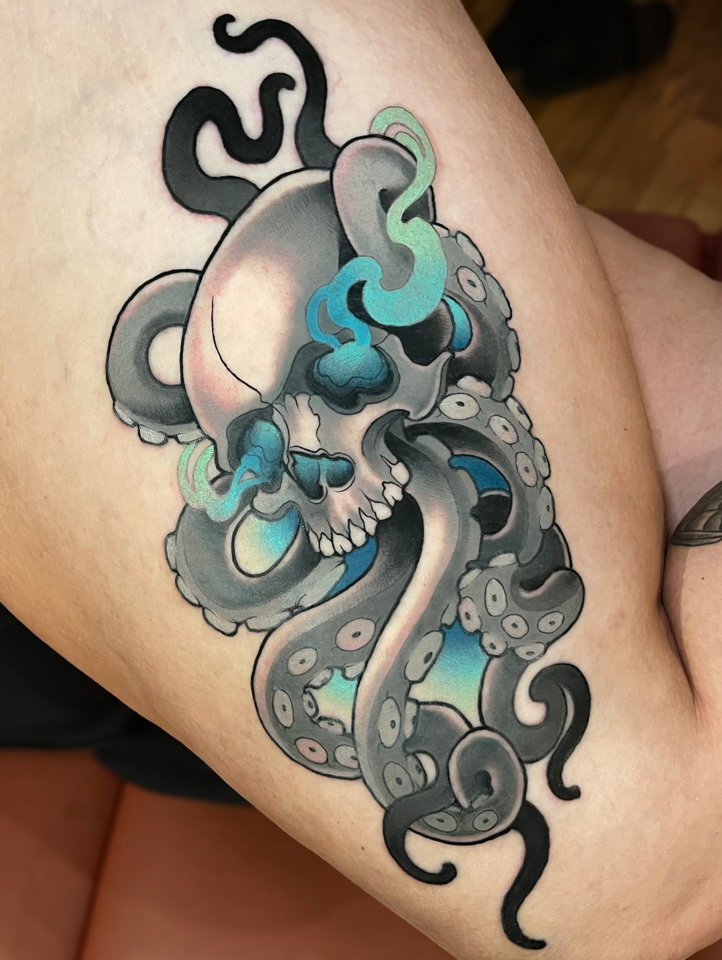 Octopus skull American traditional tattoo on the thigh by Corra Carmine