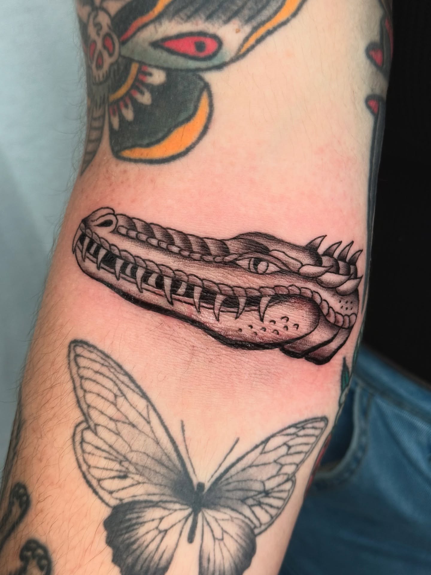 Crocodile American traditional tattoo on the forearm by Cooper