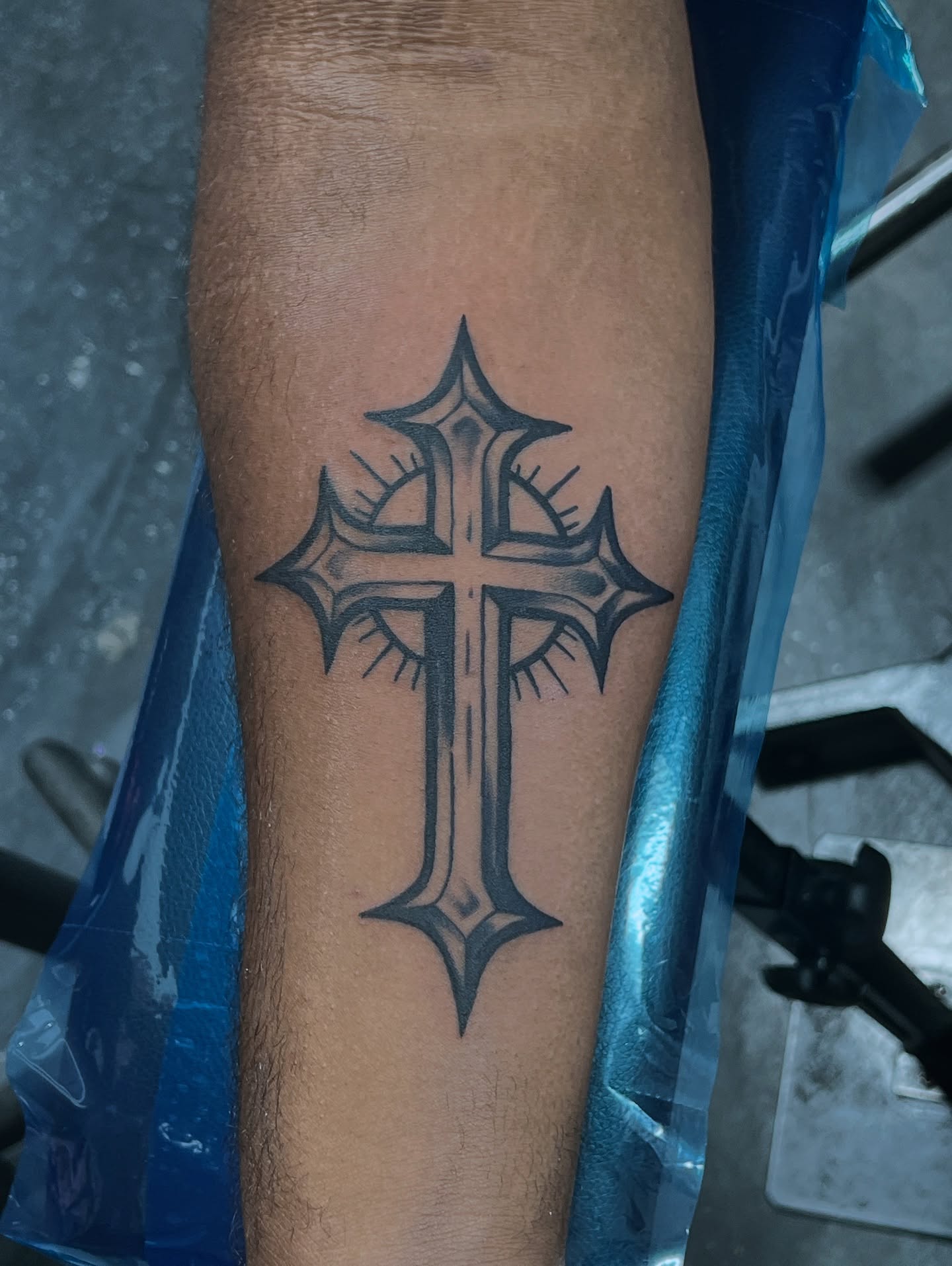 Cross black and grey tattoo on the forearm by CandiCoatedInk