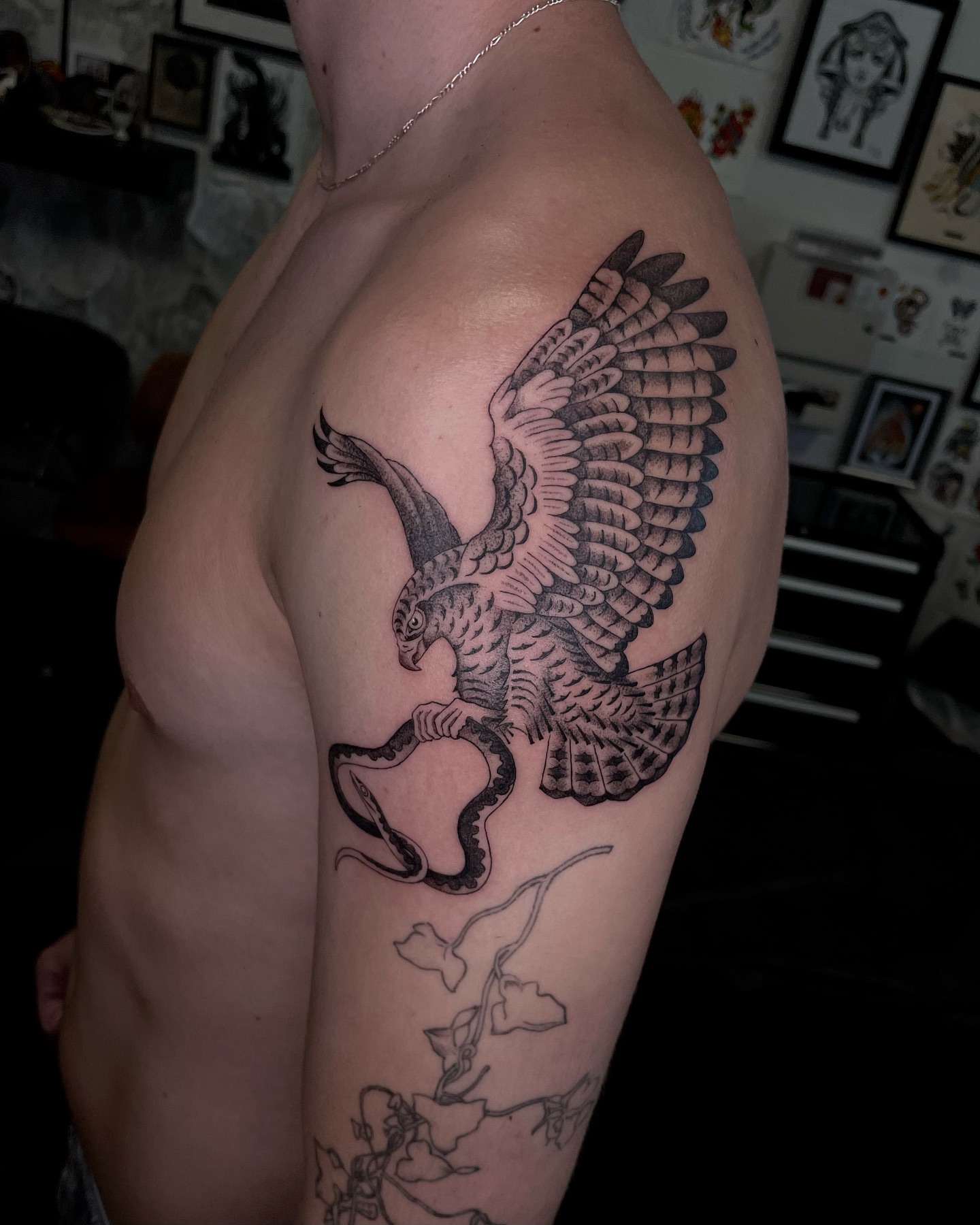 Eagle black and grey tattoo on the upper arm by Tattoo Artist, in San Francisco, CA
