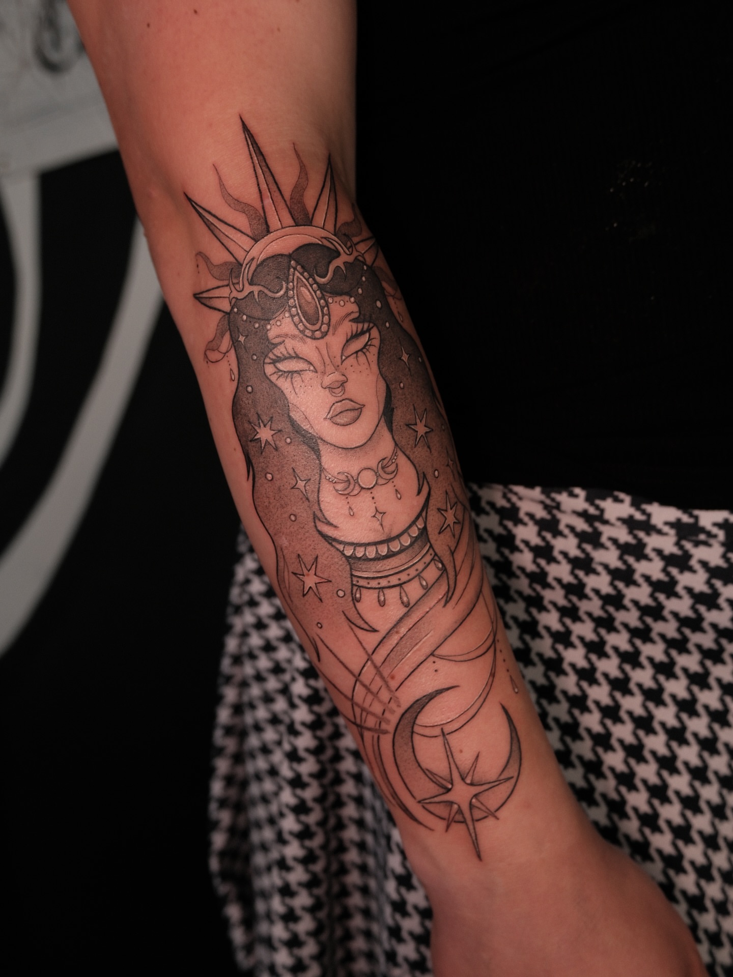 Woman with celestial motifs realism tattoo on the forearm by Velvet, Seattle, Washington