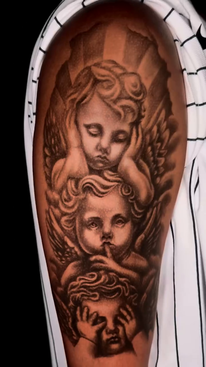 Cherubs and religious figure realism tattoo by Charlie Soto