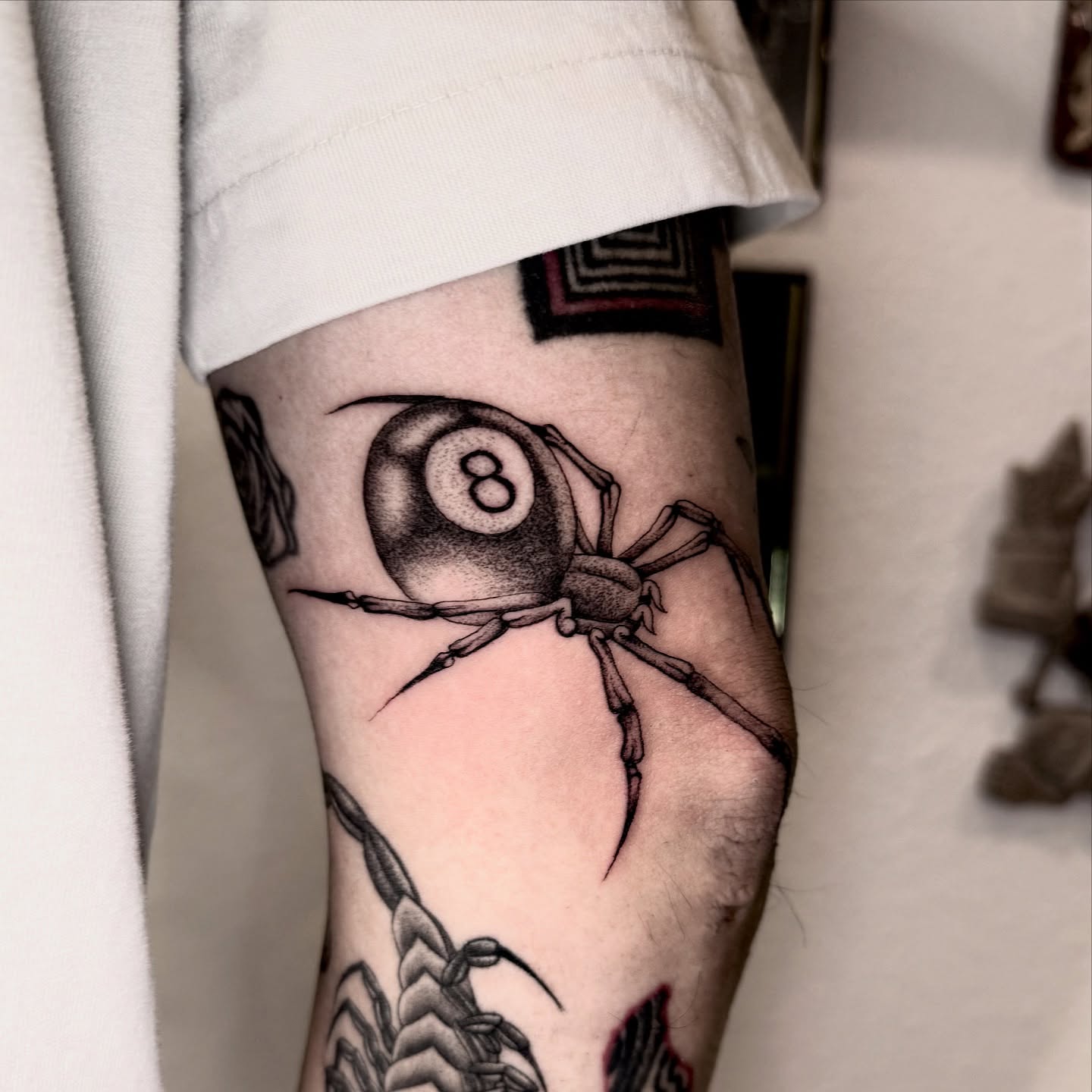 Spider with eight ball black and grey tattoo on the forearm by @sadfoo_tattoo, Austin, Texas