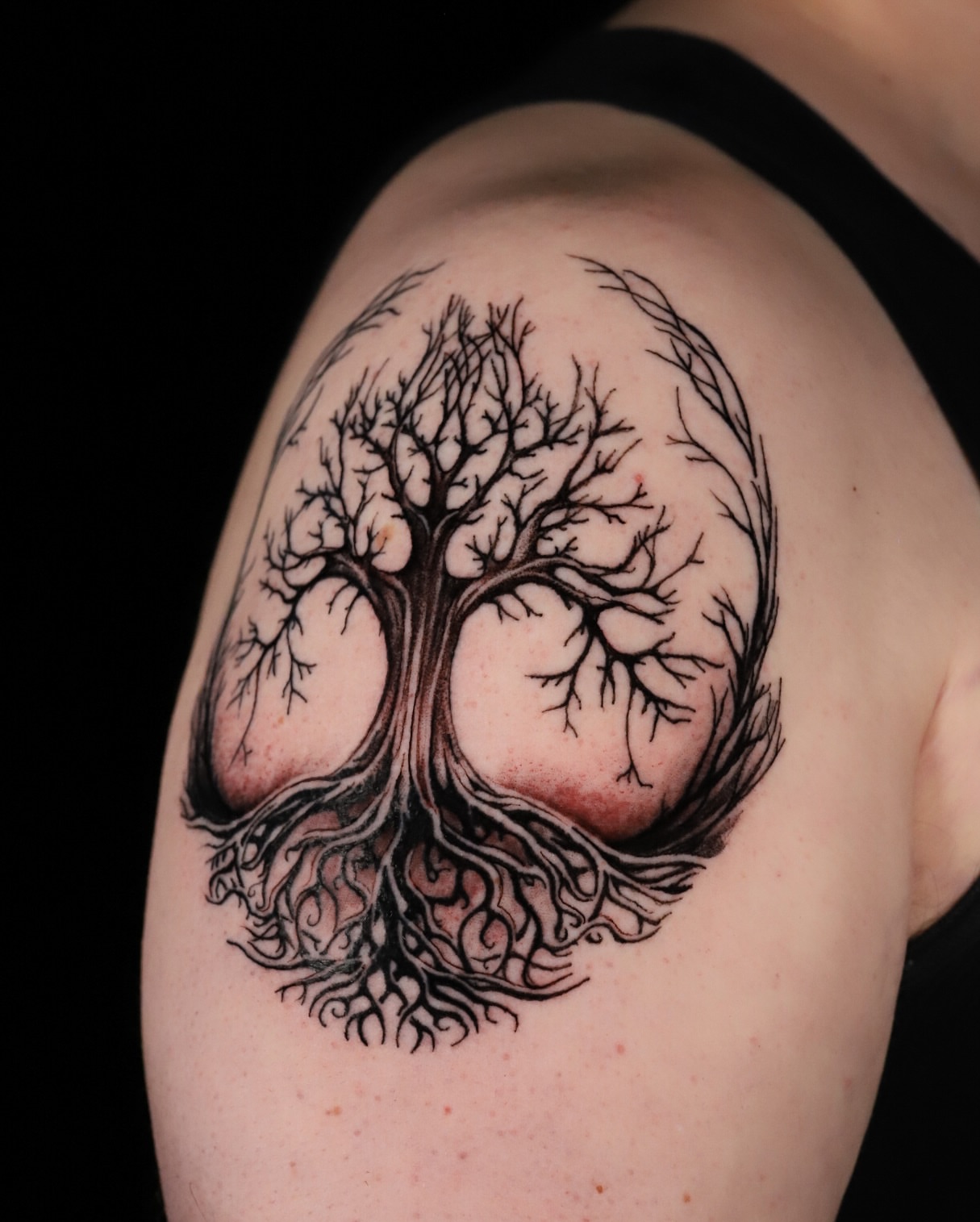 Tree black and grey tattoo on the shoulder by Ethan Lund