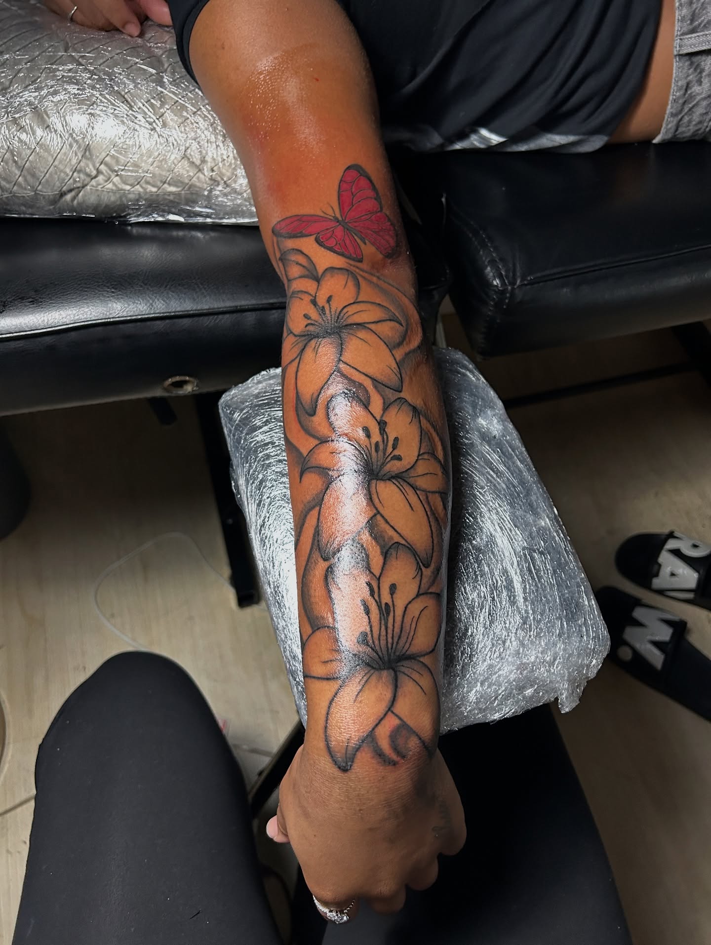 Flowers and butterfly realism tattoo on the forearm by nylachanel