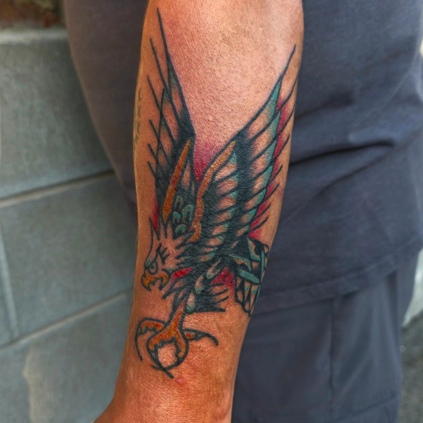 Eagle American traditional tattoo on the forearm by Mitch Braver