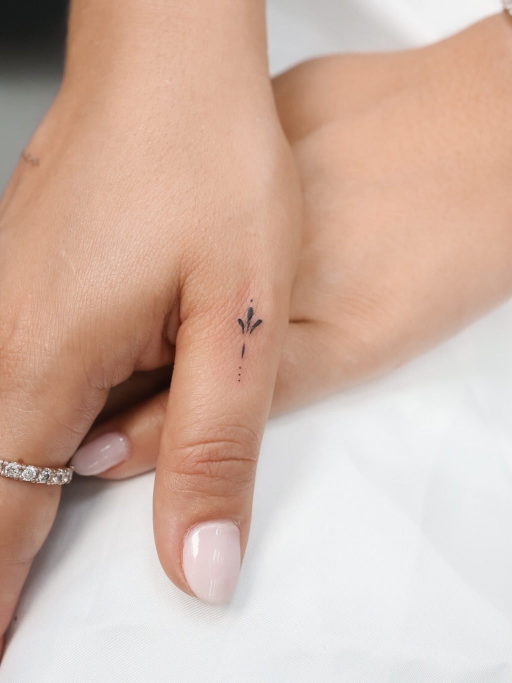 Flame dotwork tattoo on the hand by Fine Line, New York, New York