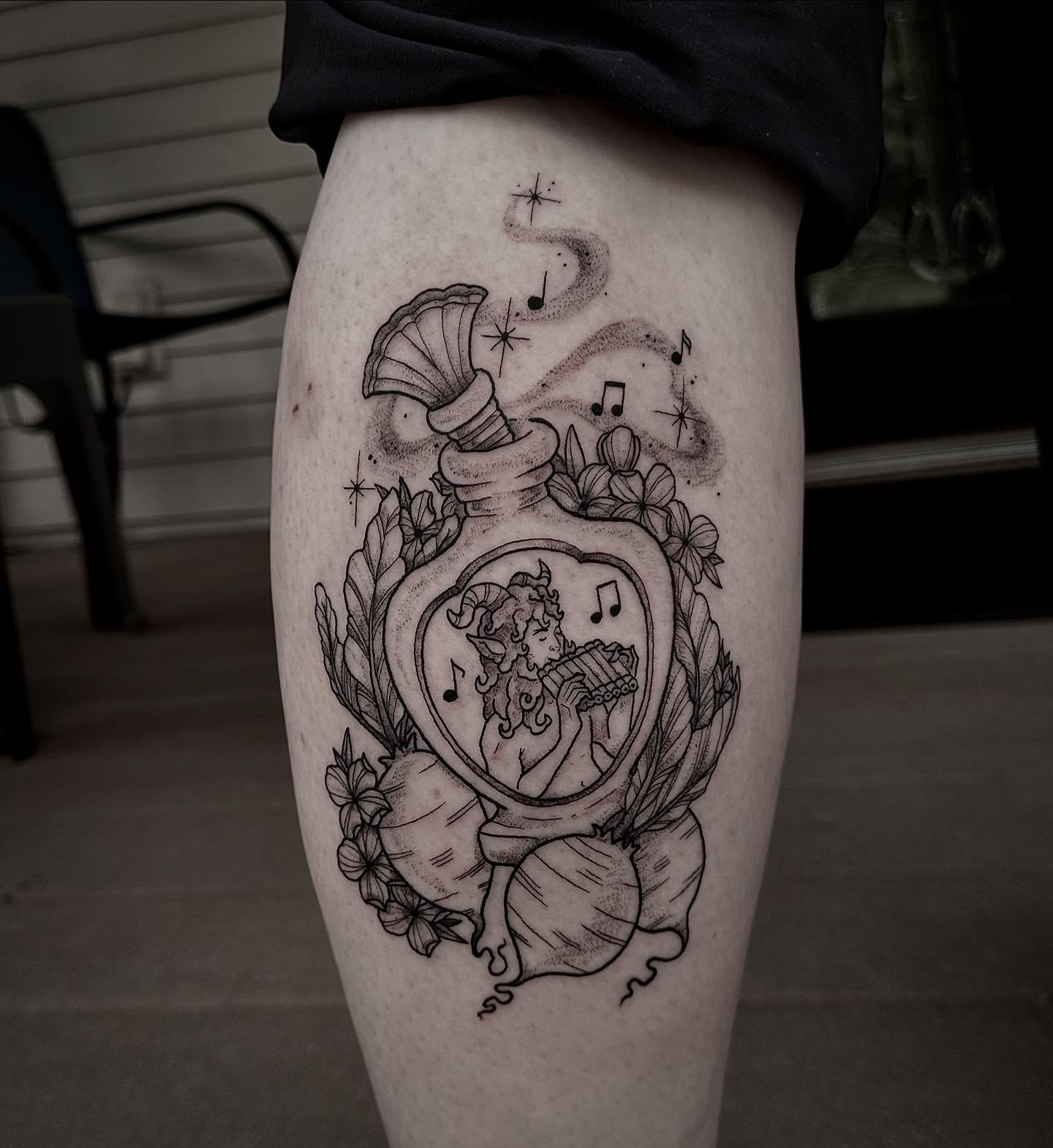 Flute player in heart dotwork tattoo on the thigh by manda, Lebanon, Ohio