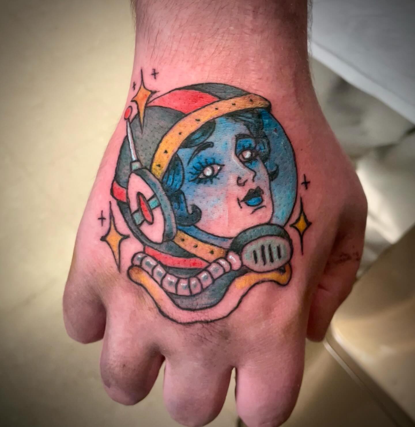 Astronaut American traditional tattoo on the hand by Logan Casimir