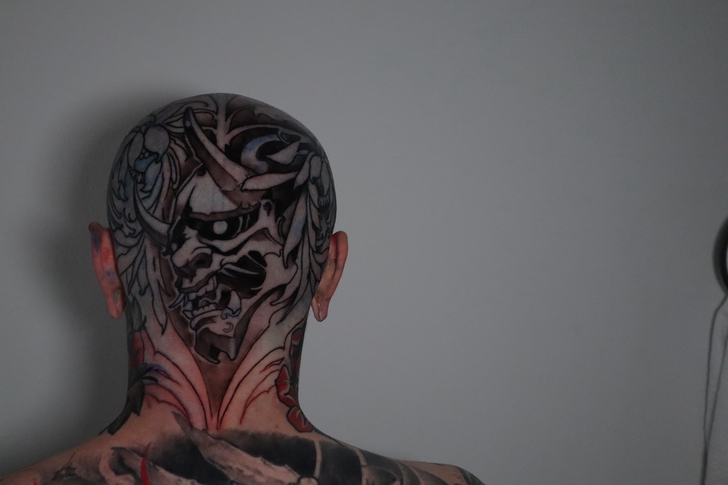Demon mask dark realism tattoo on the head by Joshua Weeks