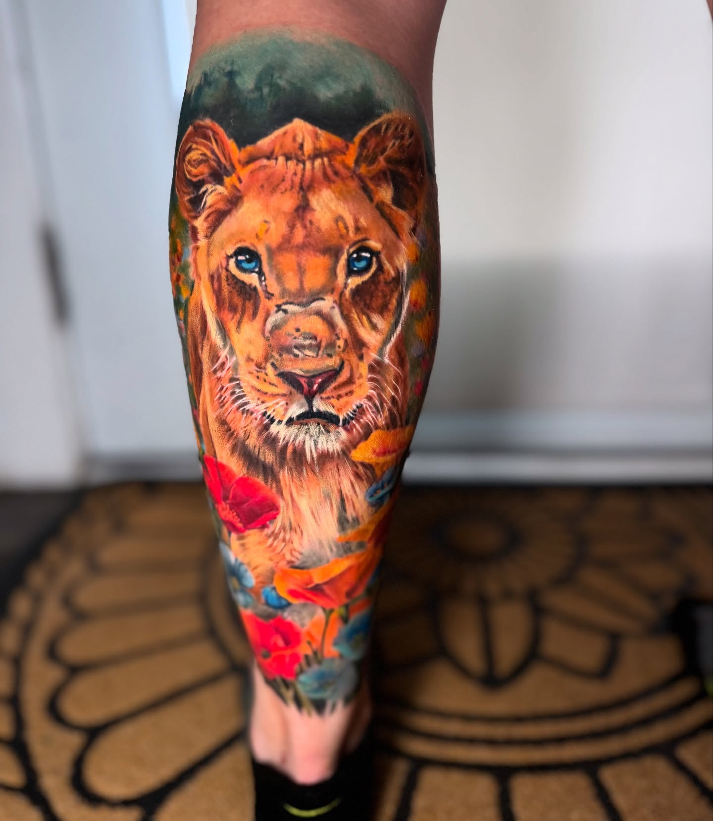 Lion realism tattoo on the calf by Hannah Mckee