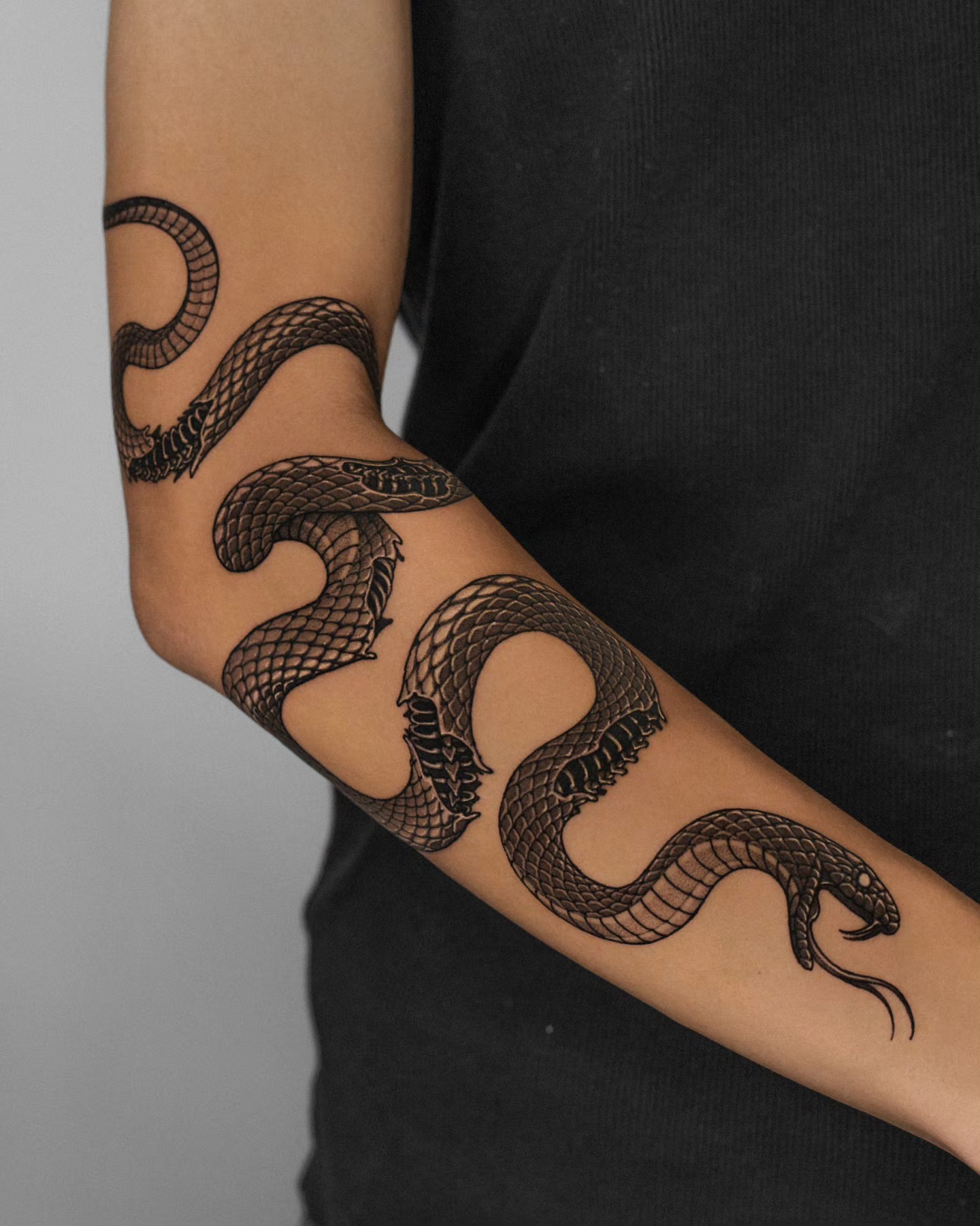 Snake black and grey tattoo on the forearm by 쿠노 Koono snaketattoo