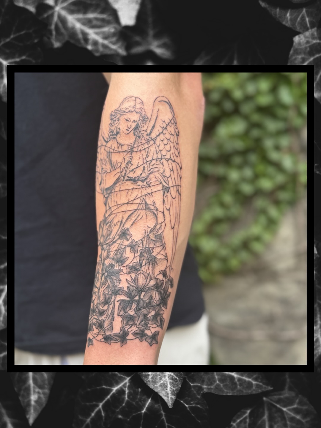 Angel with wings black and grey tattoo on the forearm by Sydney
