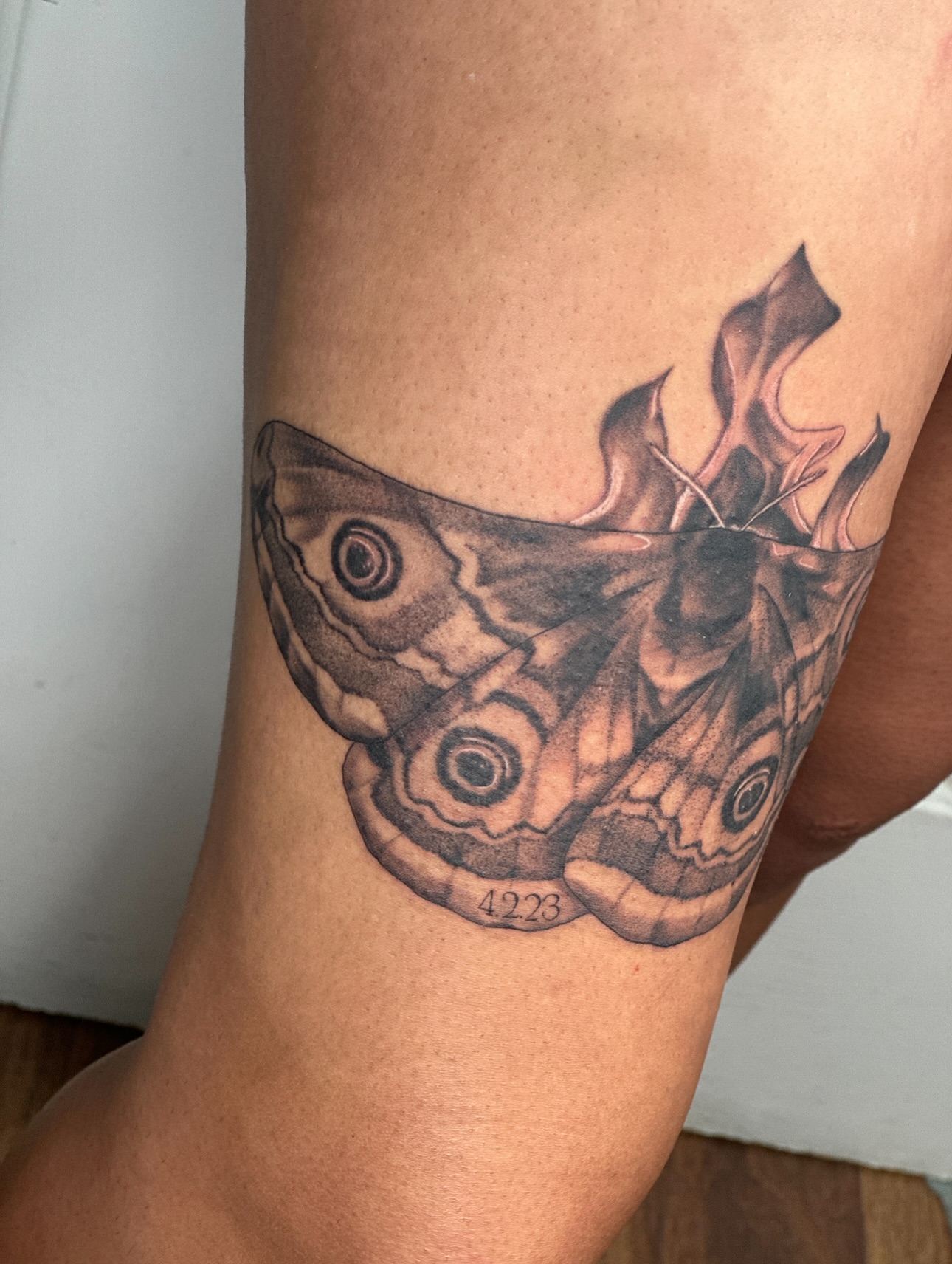 Moth black and grey tattoo on the thigh by Nashville Tattoo Artist - Nicolette Madlyne