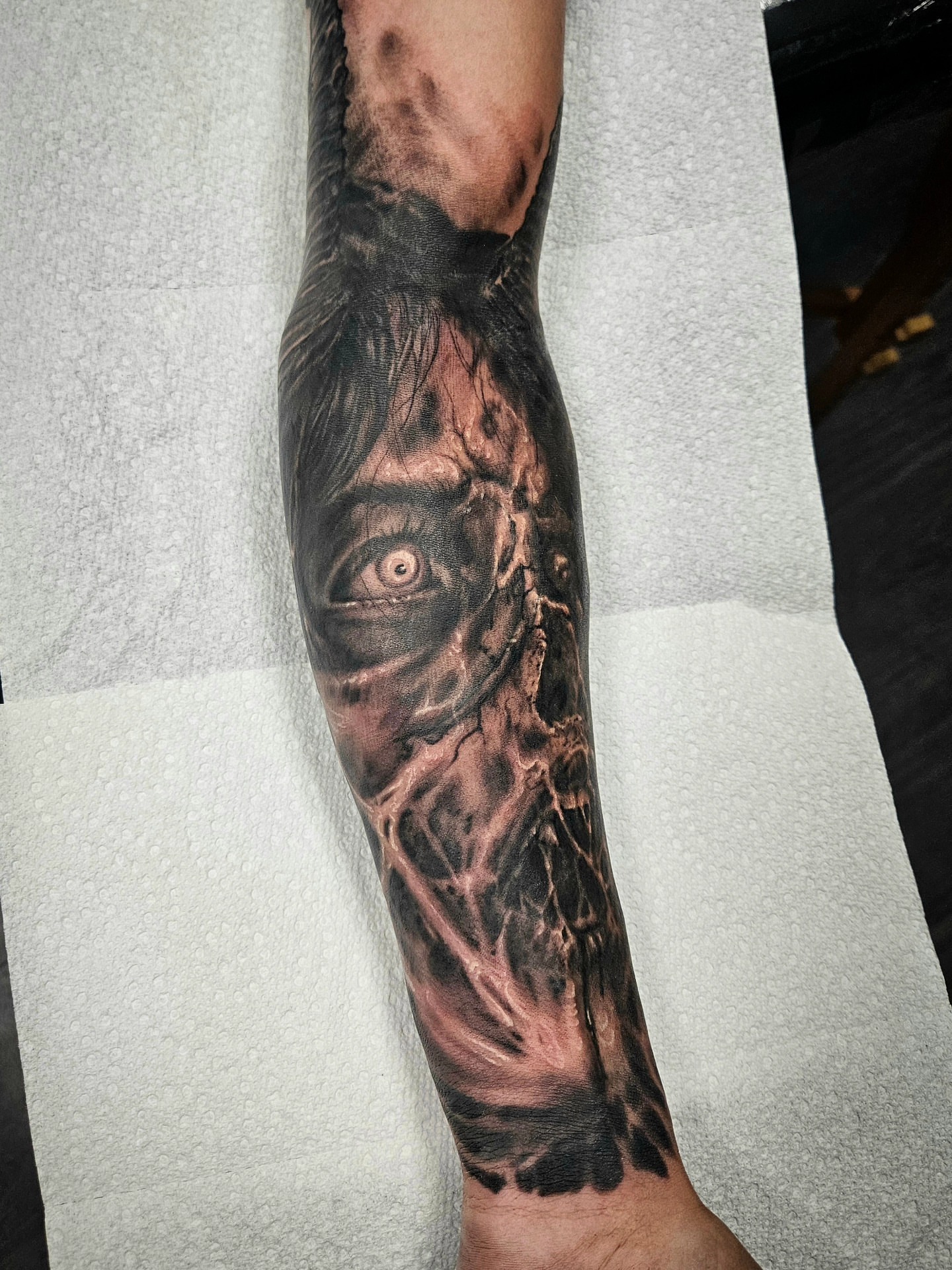 Eye and tree dark realism tattoo on the forearm by Chicagoland Tattoo artist - Dany Rojas