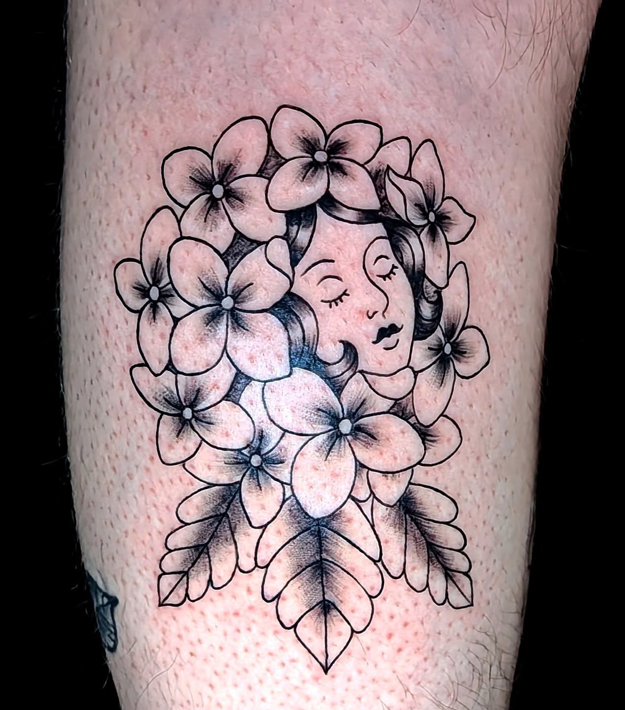 Floral bouquet black and grey tattoo on the forearm by Shannon