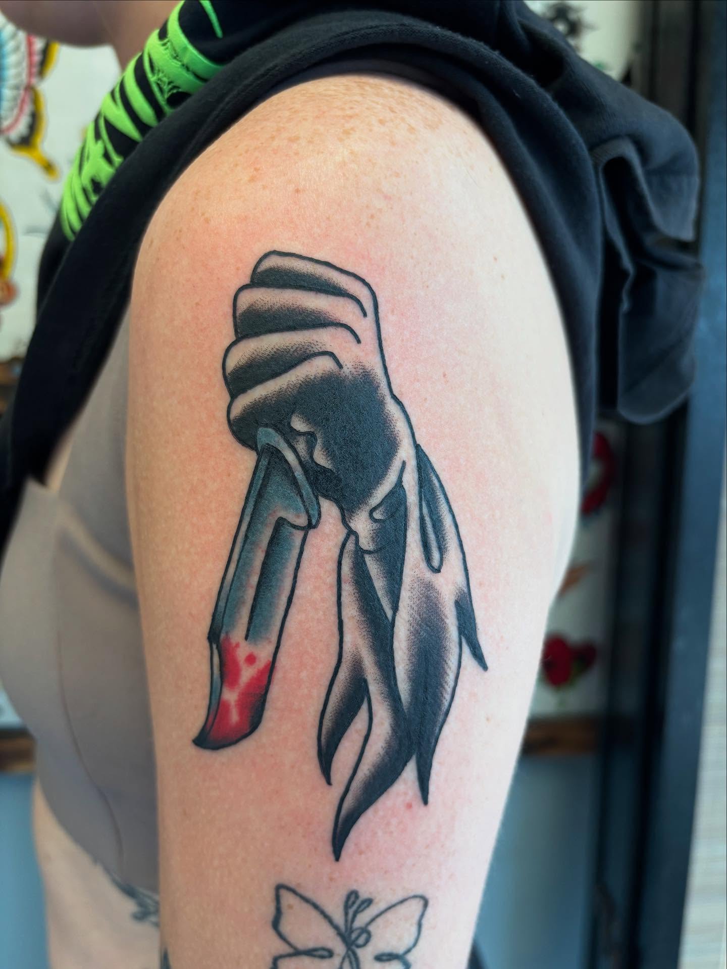 Clawed hand black and grey tattoo on the upper arm by Ben Whyte