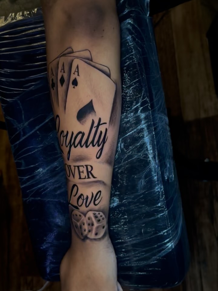 Royalty over love American traditional tattoo on the forearm by Chris (Pikasso)