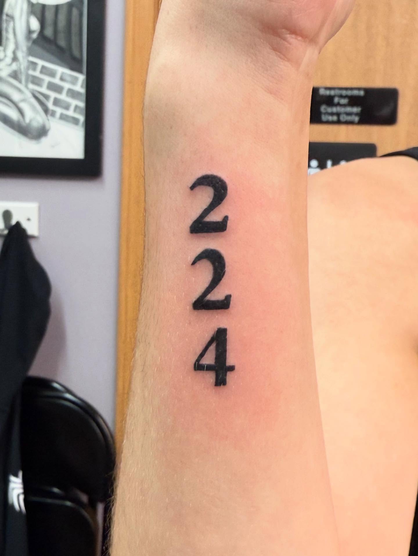 Number tattoo black and grey tattoo by Hunter Beyer