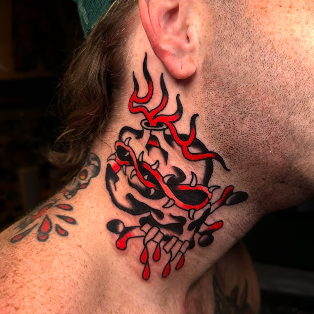 Flame skull neo-traditional tattoo on the neck by Schyler Ames, Canal Fulton, Ohio