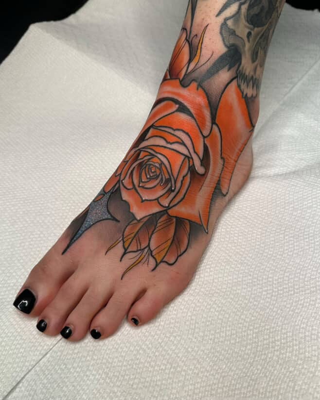 Orange rose American traditional tattoo on the foot by E