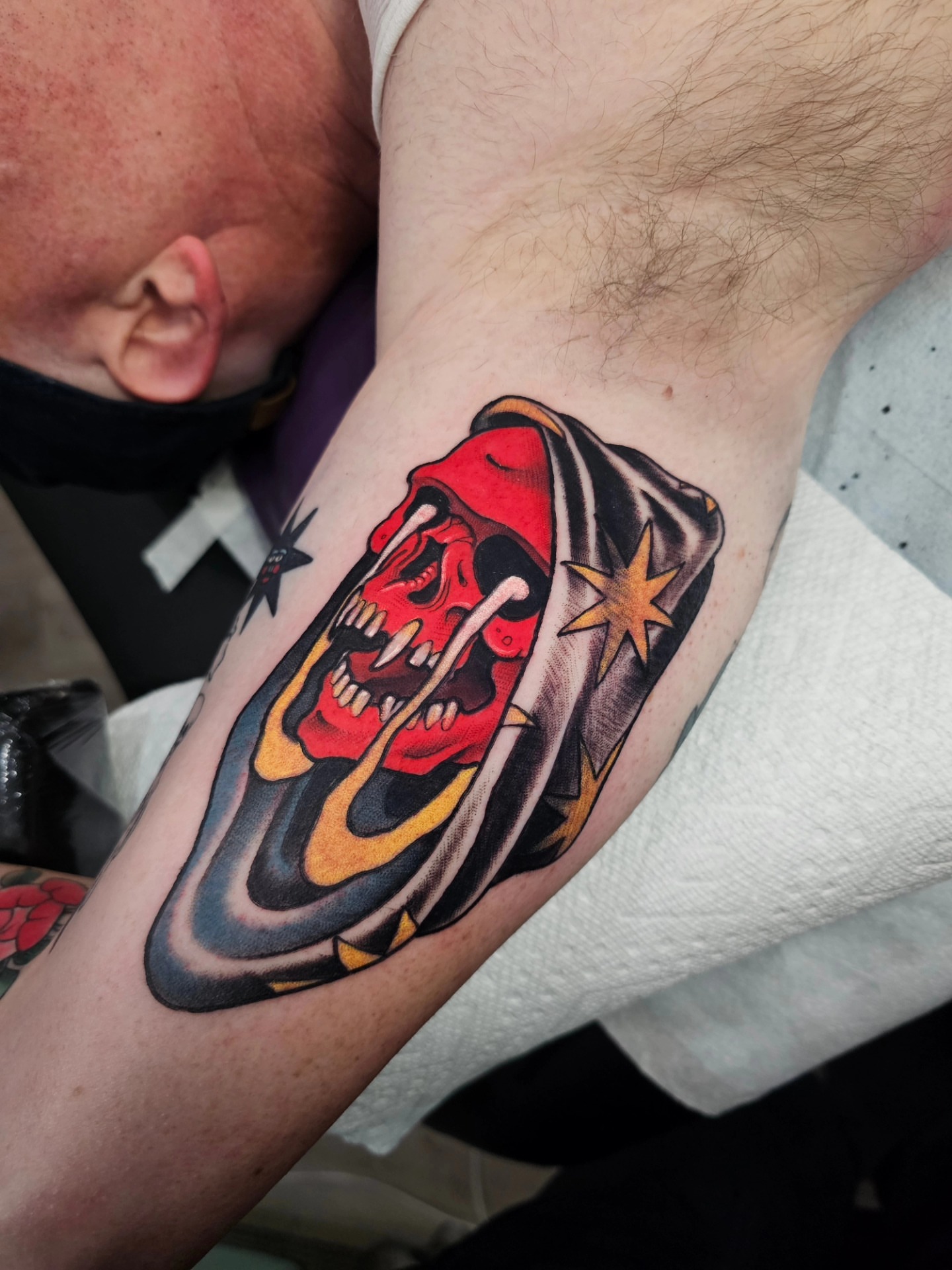 Skull with stars American traditional tattoo on the forearm by Shannon