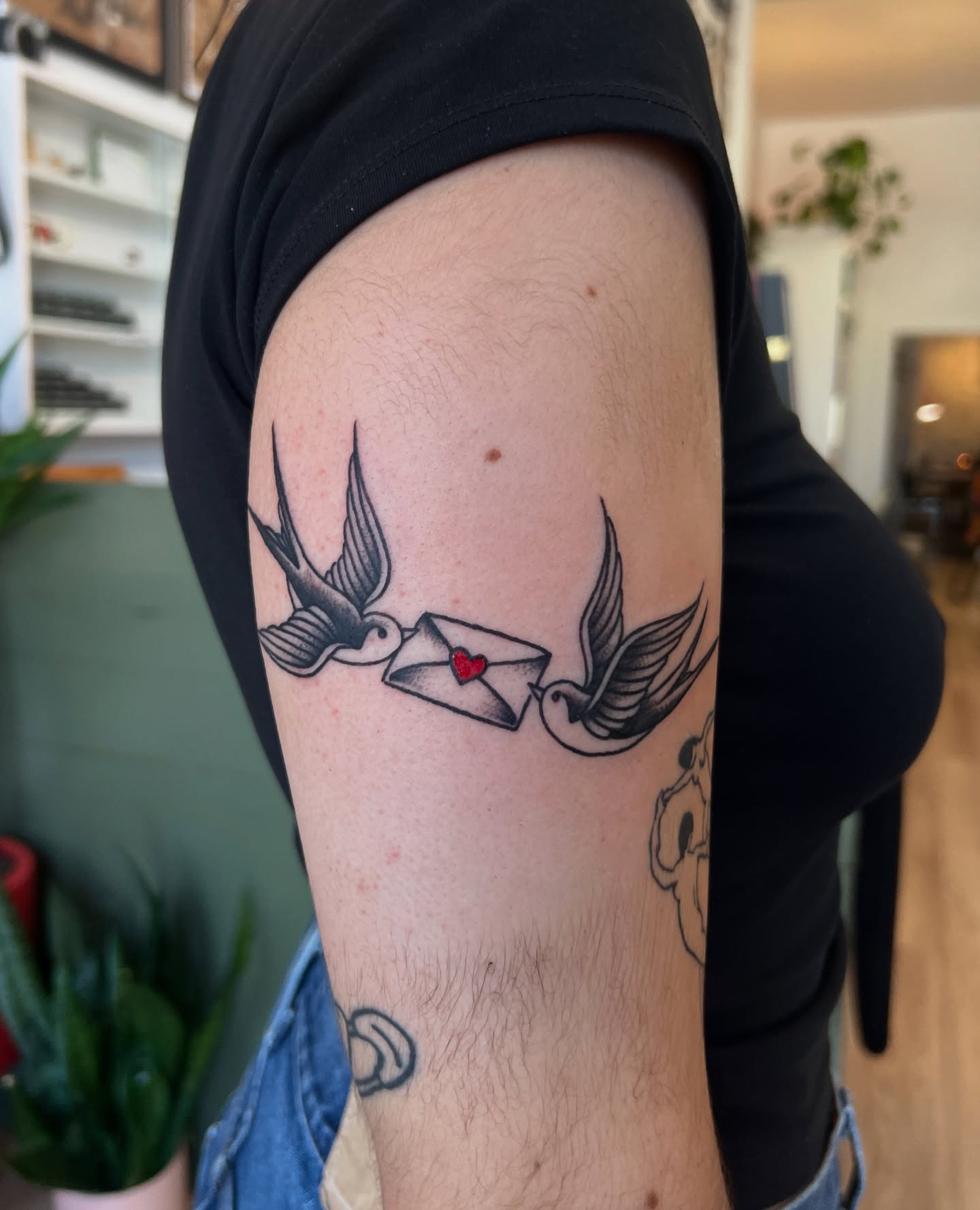 Swallows and envelope black and grey tattoo on the forearm by @syrenbier, San Francisco, California