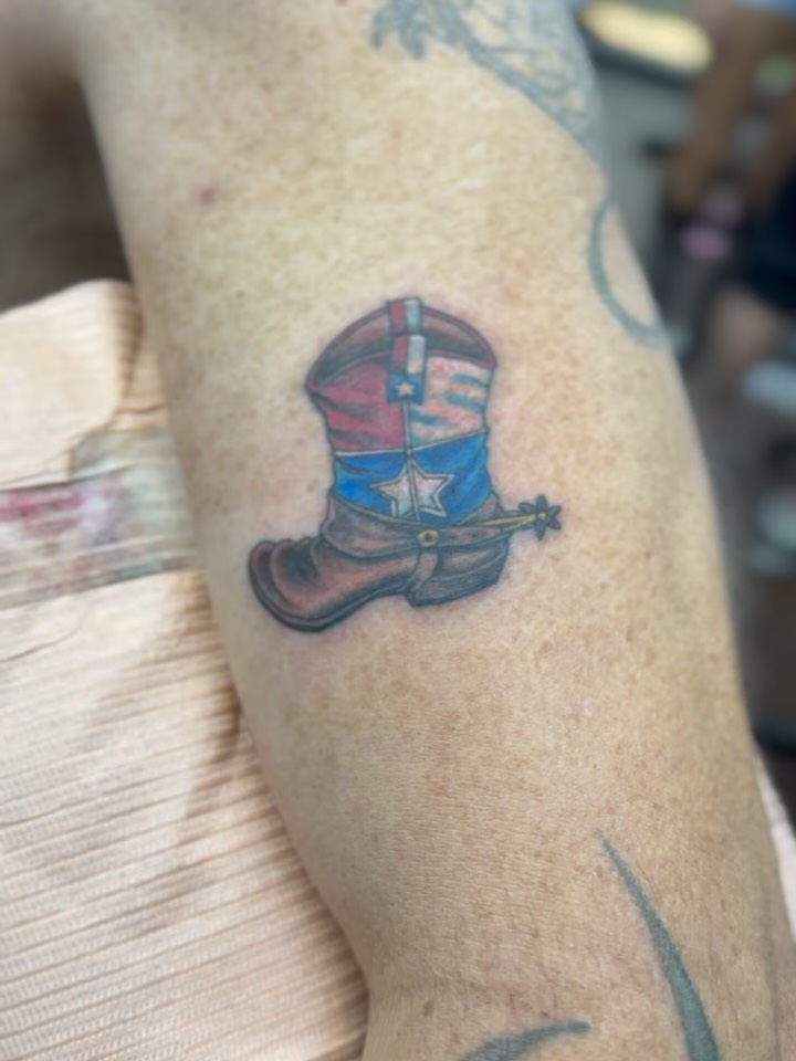 Cowboy boot American traditional tattoo on the forearm by Aaron Hassler, Nashville, Tennessee