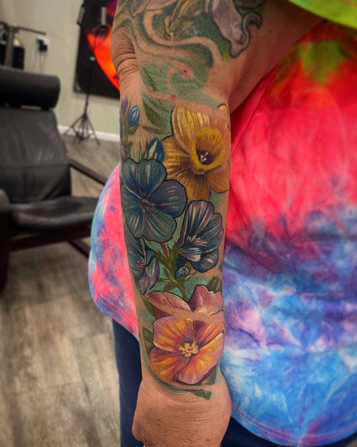 Floral bouquet realism tattoo on the forearm by Kodi Klo