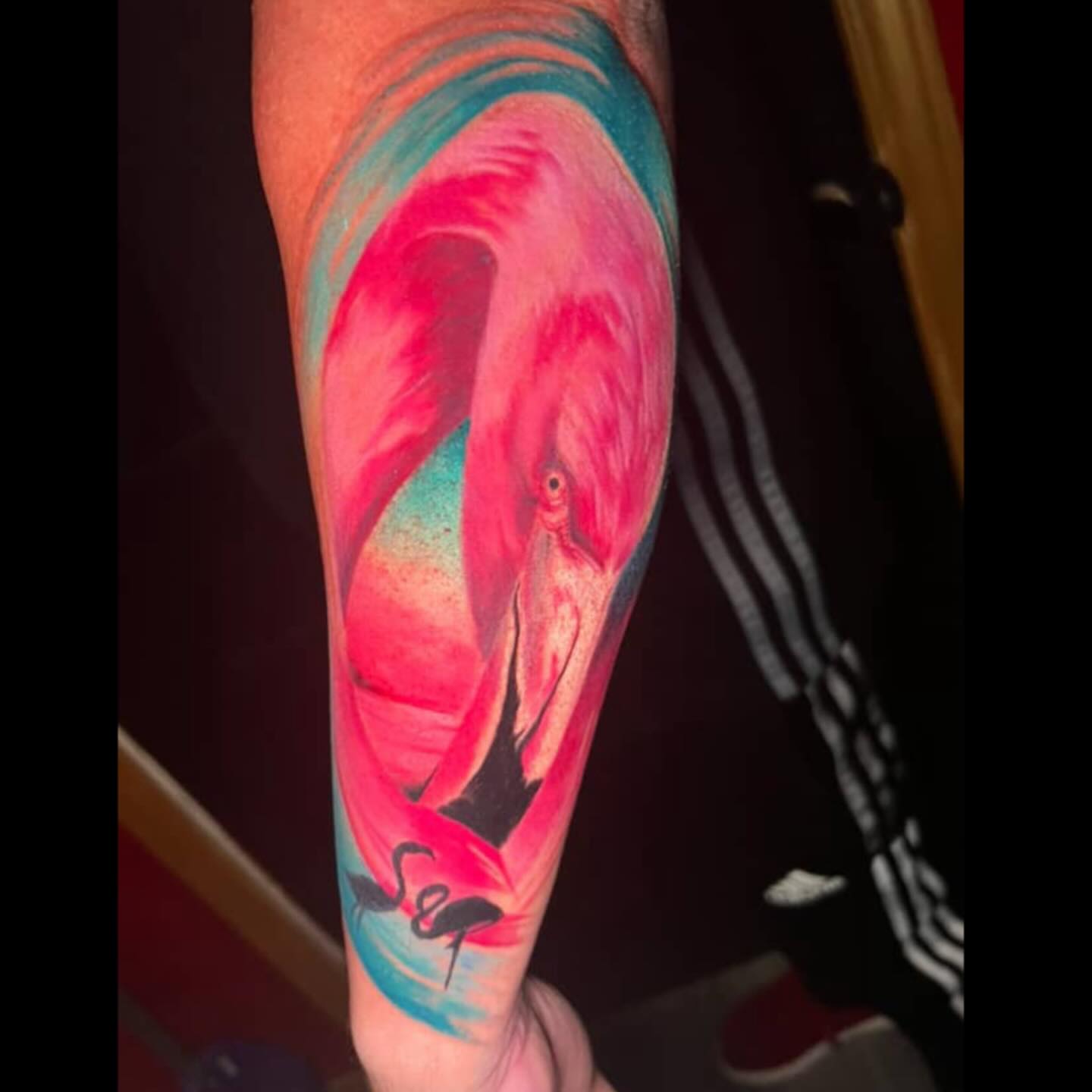 Flamingo watercolor tattoo on the forearm by Bobby Hurst