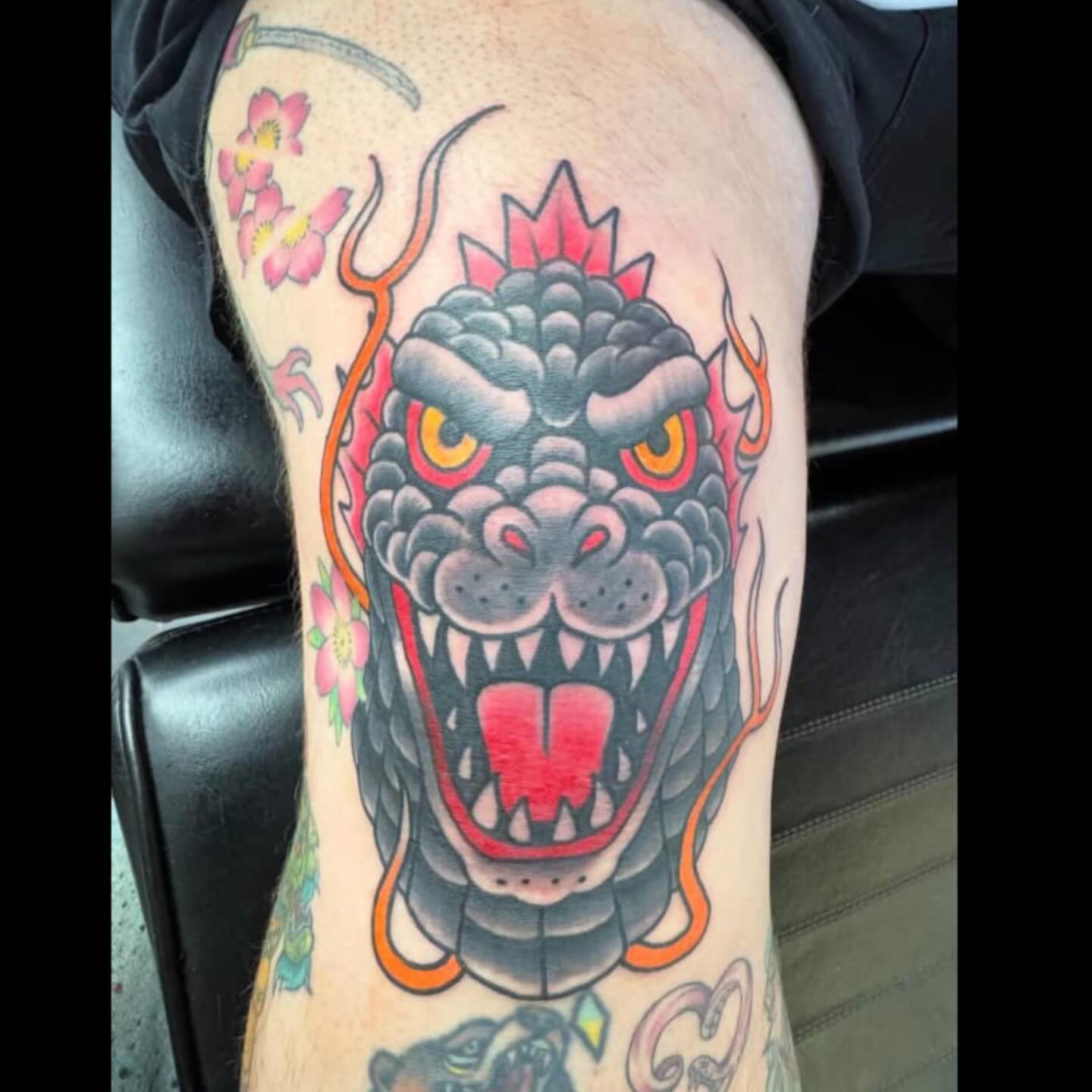 Dragon American traditional tattoo on the thigh by Bobby Hurst