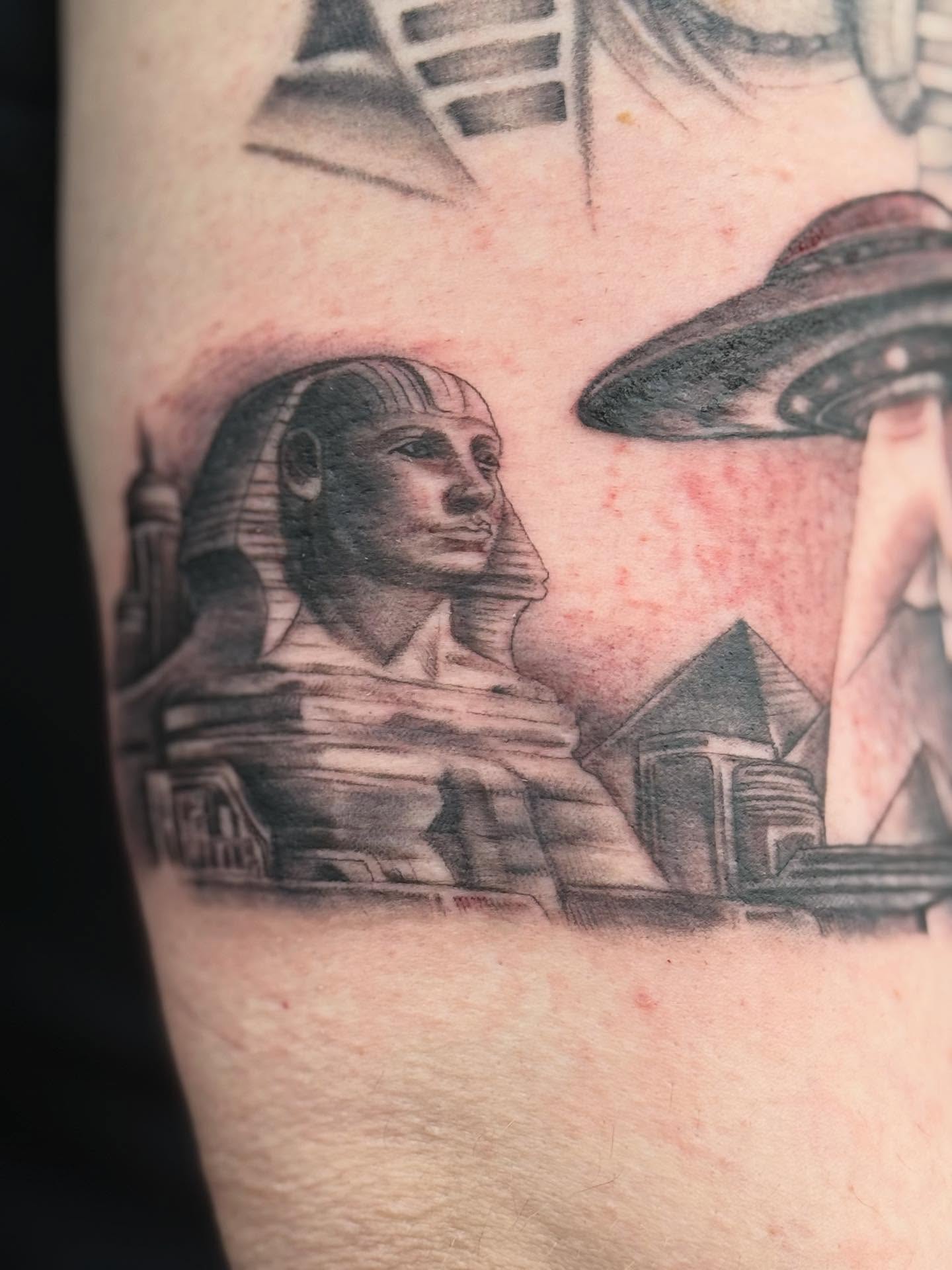 Sphinx and ufo realism tattoo on the forearm by Aaron Hassler, Nashville, Tennessee