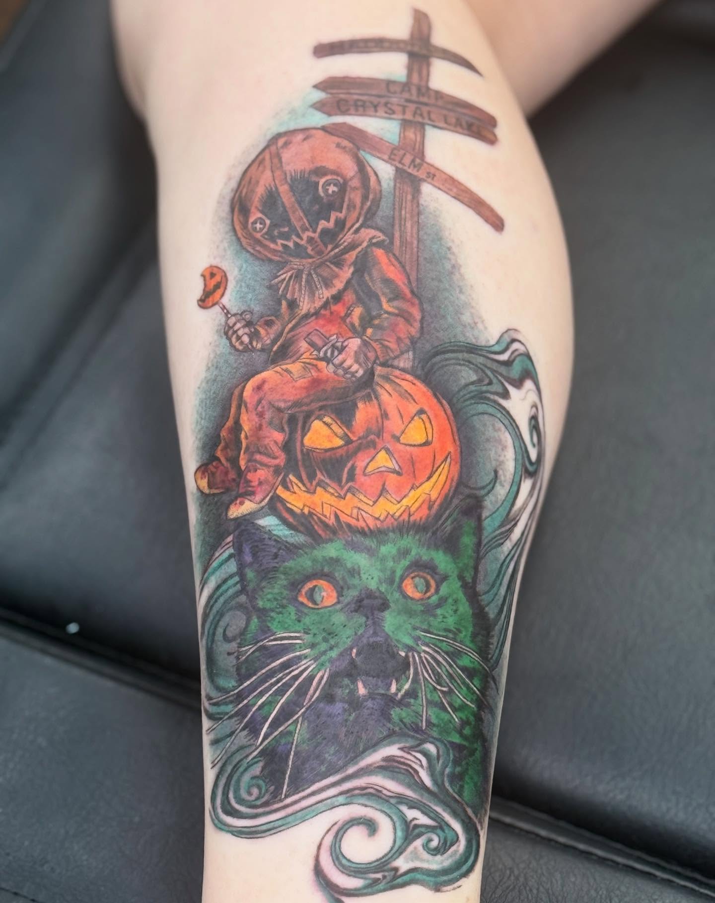 Clown and cat dark realism tattoo on the forearm by Aaron Hassler, Nashville, Tennessee