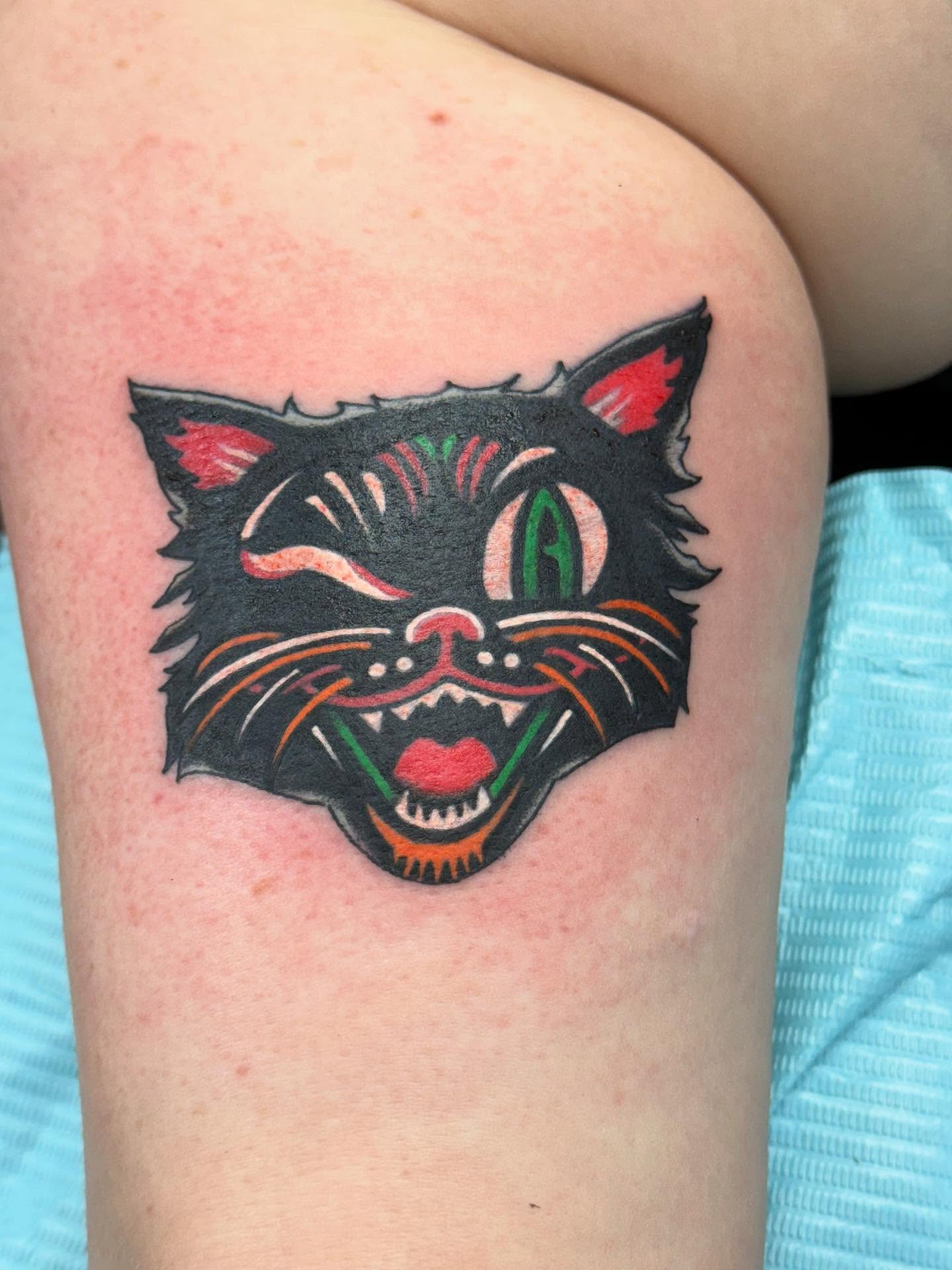 Cat head American traditional tattoo on the thigh by Aaron Hassler, Nashville, Tennessee