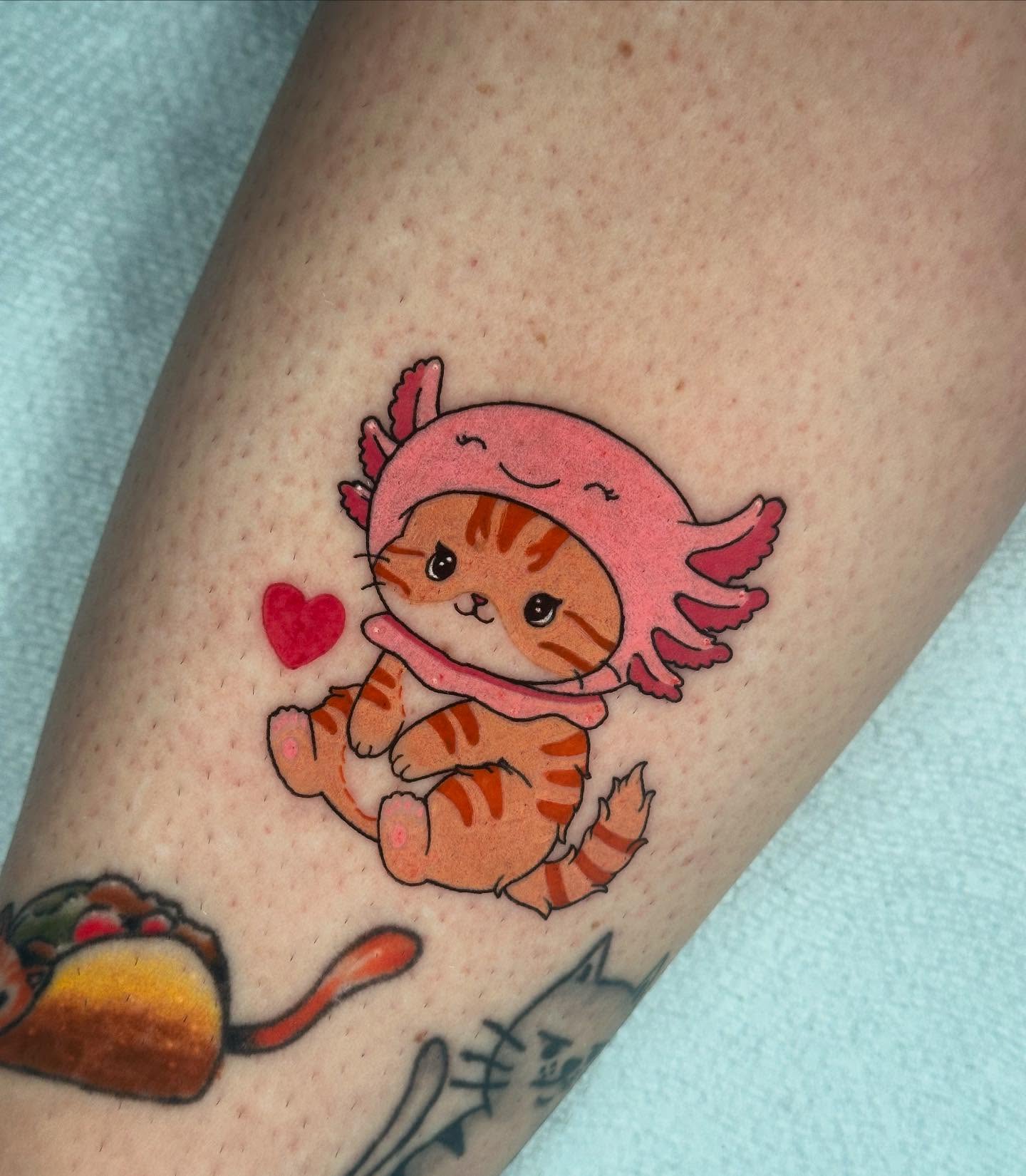 Cat wearing hat dotwork tattoo on the forearm by Lexi Wilkinson