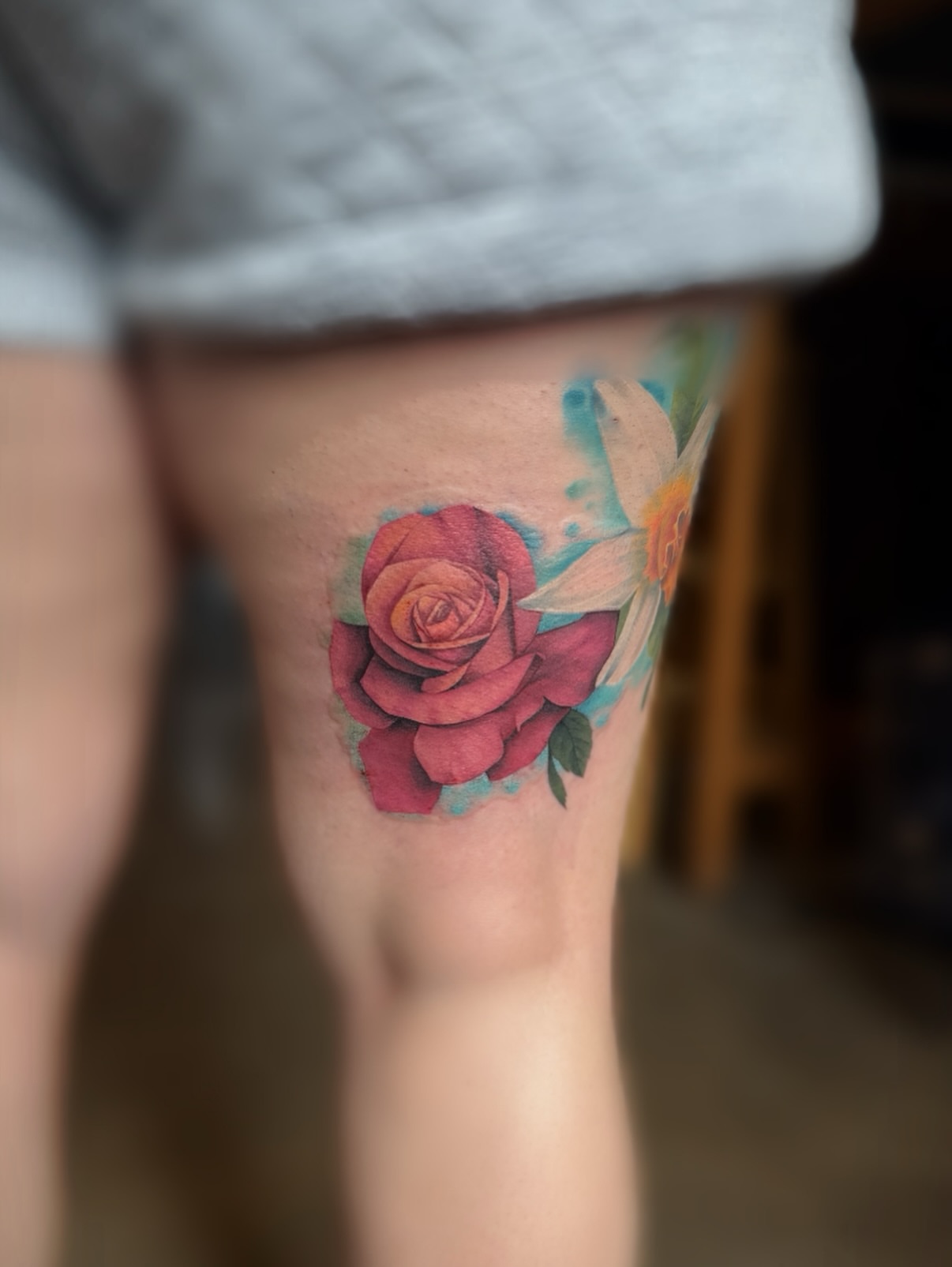Flower watercolor tattoo on the thigh by Kbryanttattoos, Ohio City, Ohio