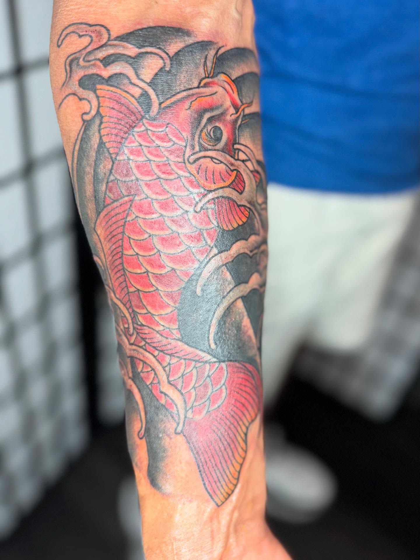 Koi fish American traditional tattoo on the forearm by Justina🪐