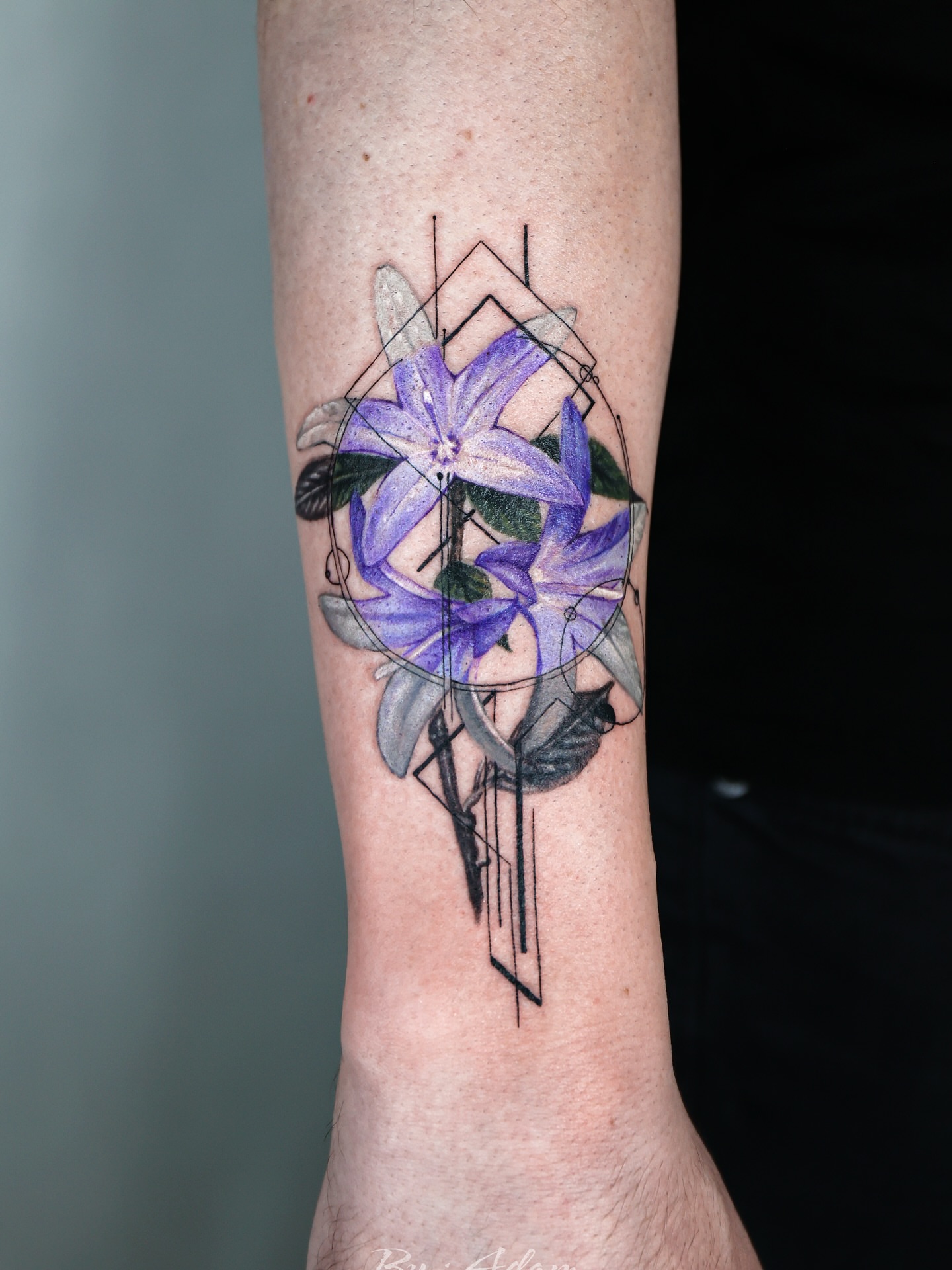 Purple flowers geometric tattoo on the forearm by Adam_Zhiwei Xu(Tattooist)