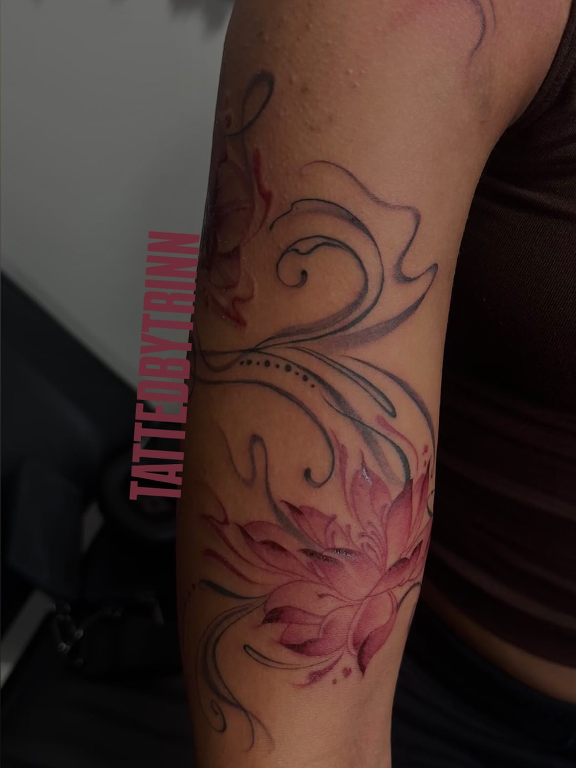 Lotus flower dotwork tattoo on the forearm by Tattedbytrinn