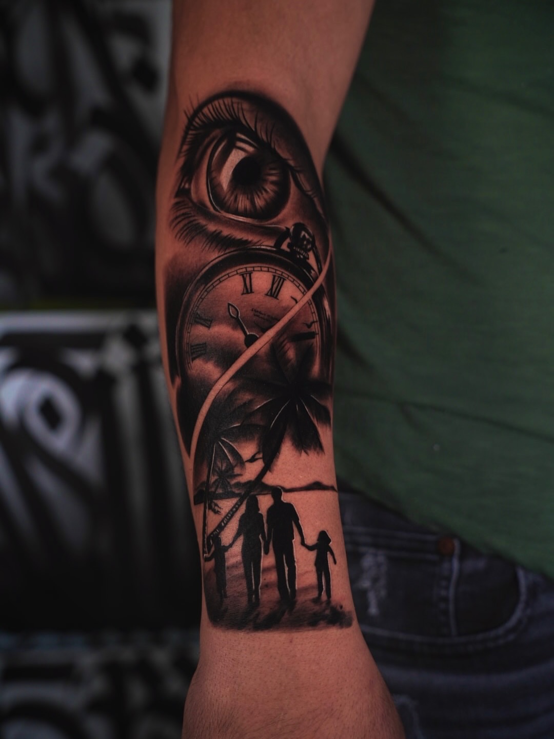Family silhouette realism tattoo on the forearm by Andy Garcia