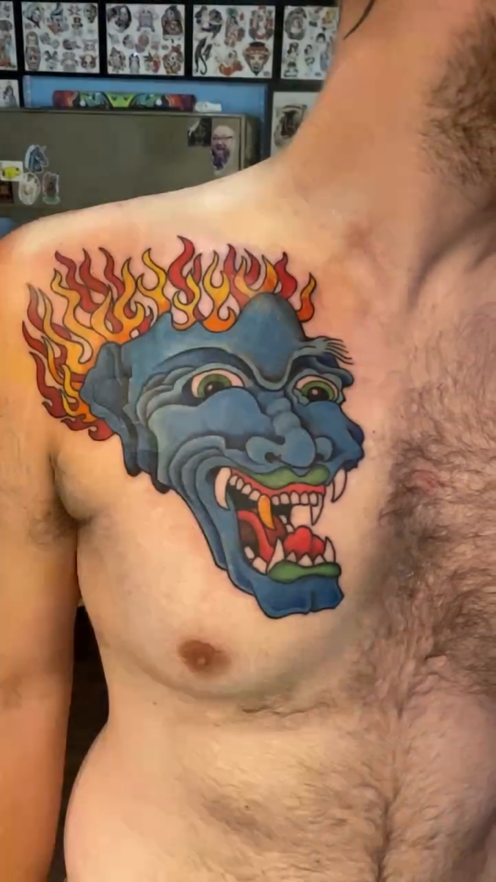Blue Oni mask with flames ignorant tattoo on the chest by jim collins, Dayton, Ohio