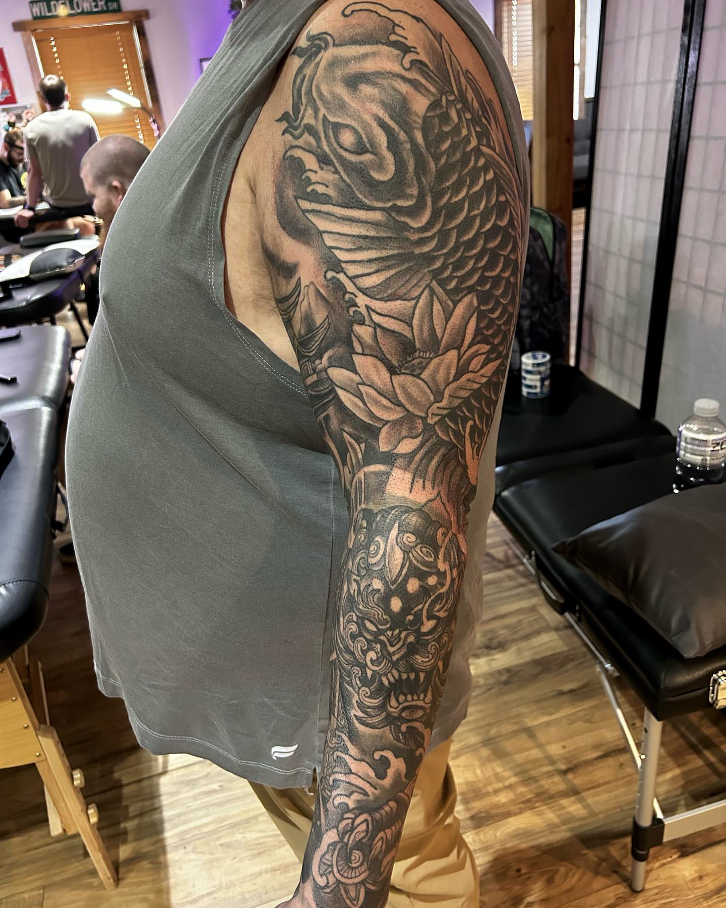 Koi fish japanese irezumi tattoo on the upper arm by Cody Lambert