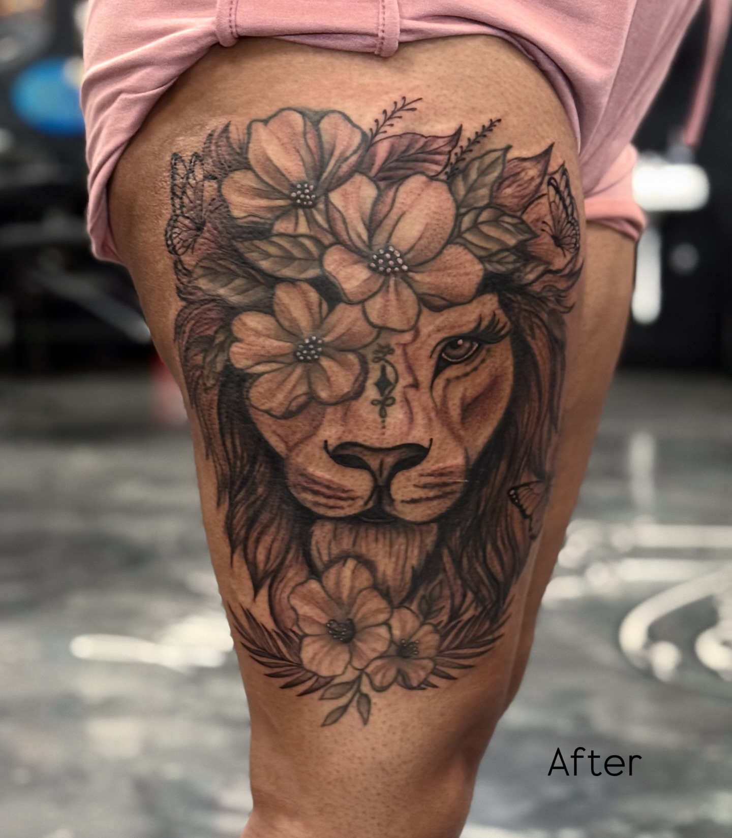 Lion with floral crown realism tattoo on the thigh by Paola Pineda Tattoo, Knoxville, Tennessee
